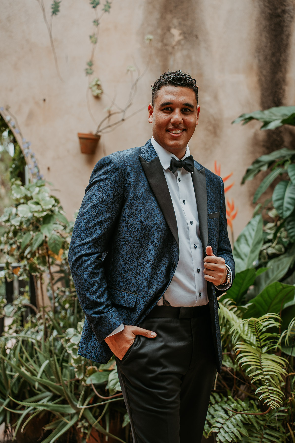 Groom smiles at Hacienda Campo Rico wedding.