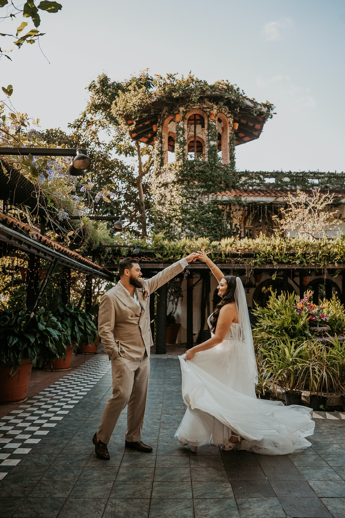 Couple doing their first dance surrounded by wedding guests at The Courtyard on Hacienda Siesta Alegre wedding venue
