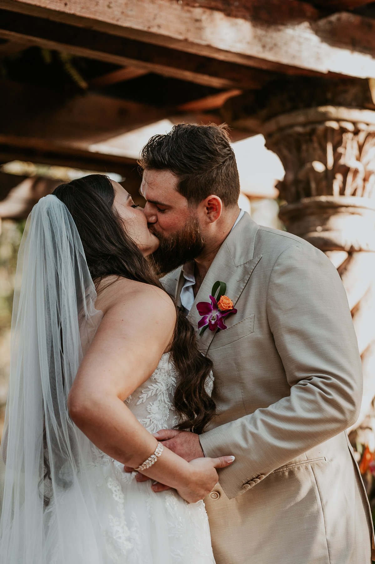 Close-up of couple sharing their first kiss as newlyweds