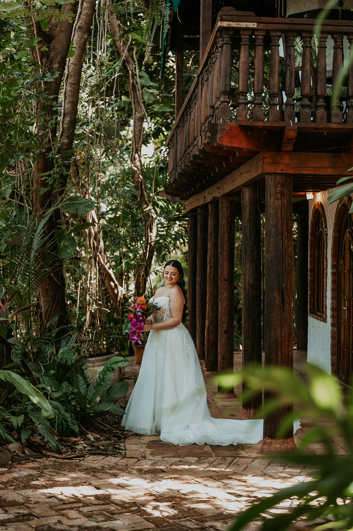 Bride portrait surrounded by lush greenery at Hacienda Siesta Alegre