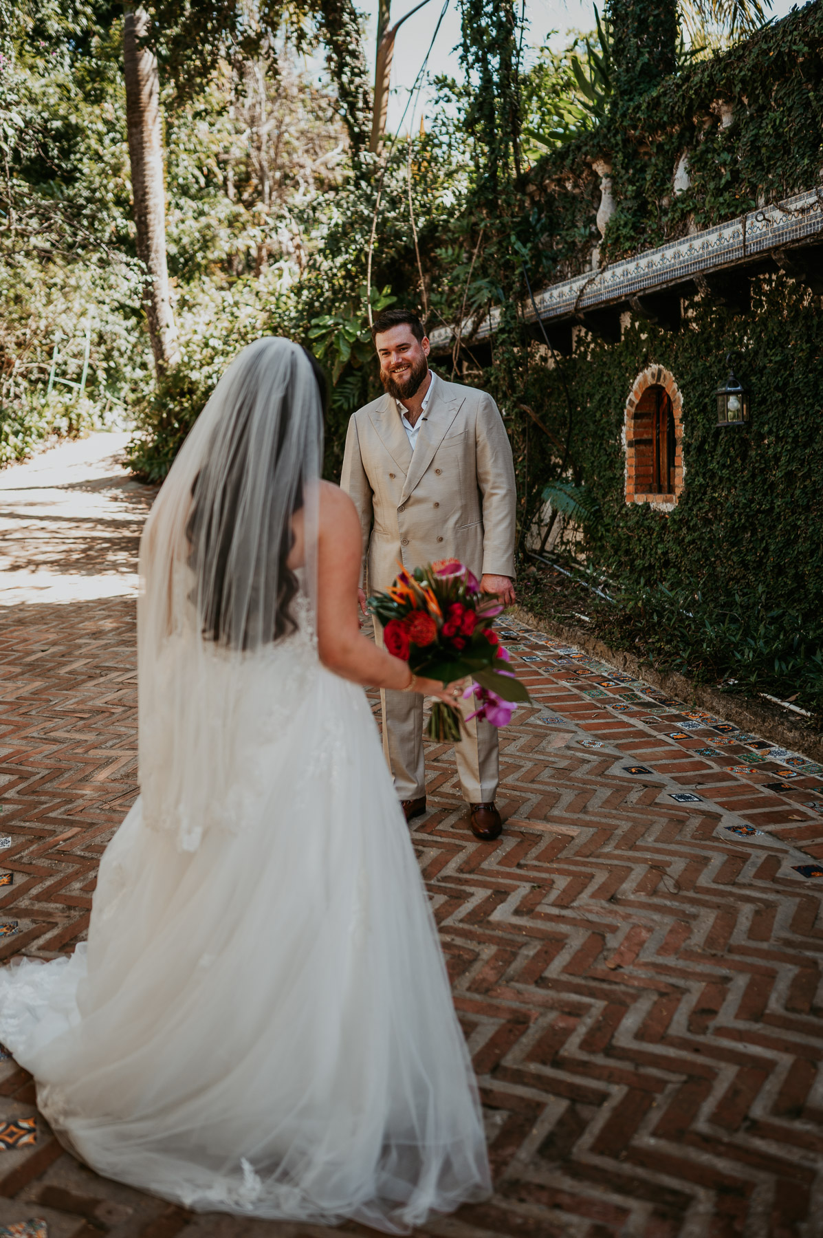 Groom reacting emotionally during the first look