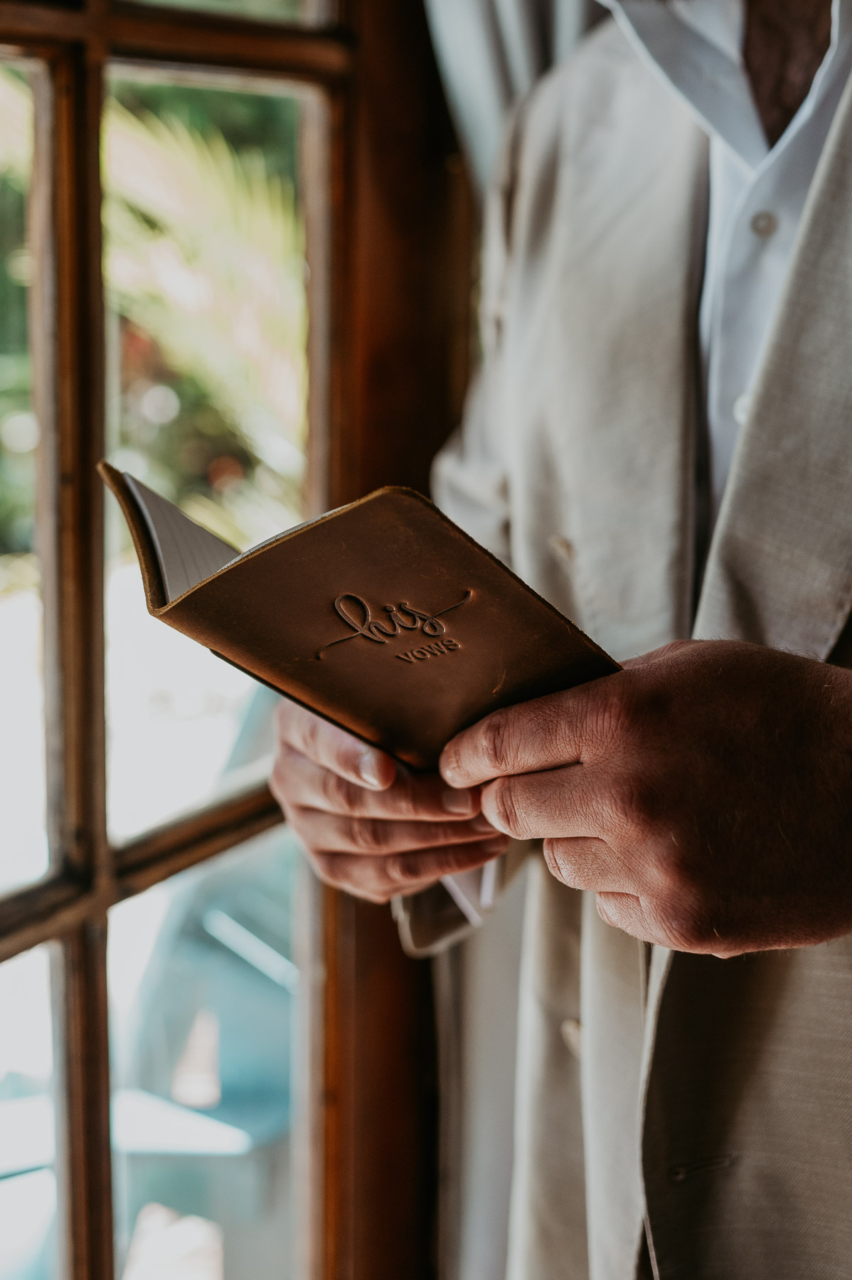 Groom reading his vows alone before the wedding ceremony