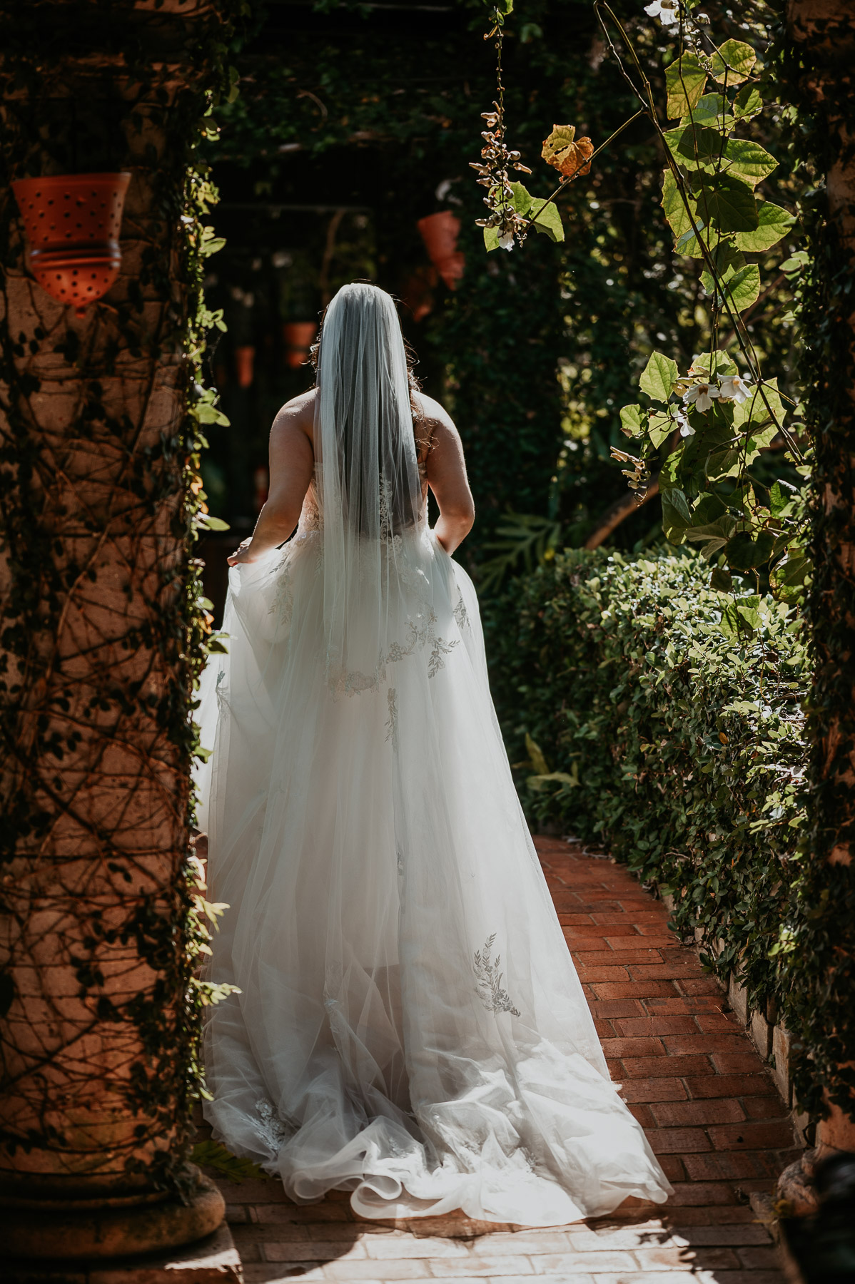 Bride showing the details of her wedding dress