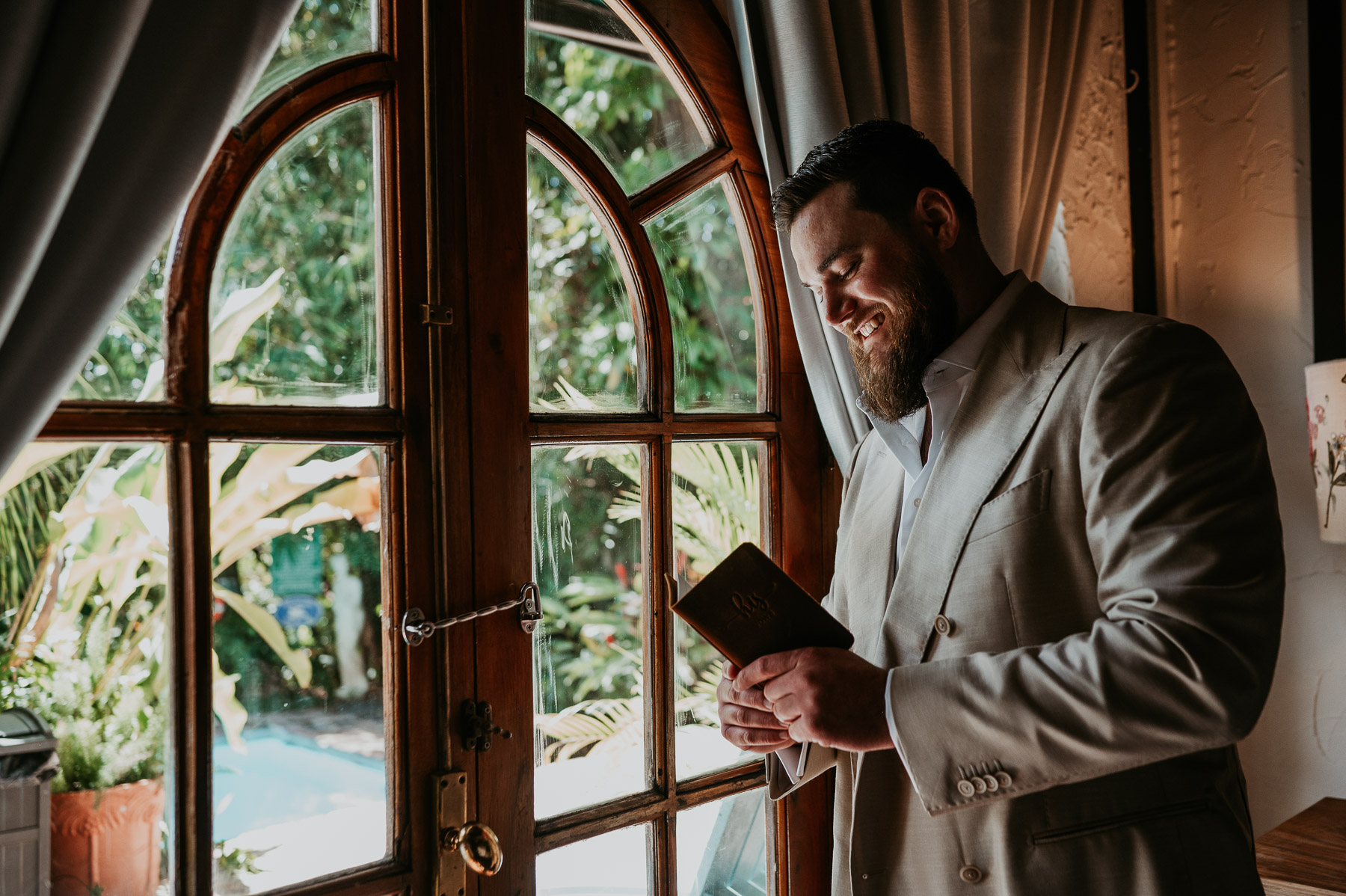 Groom reading his vows alone before the wedding ceremony