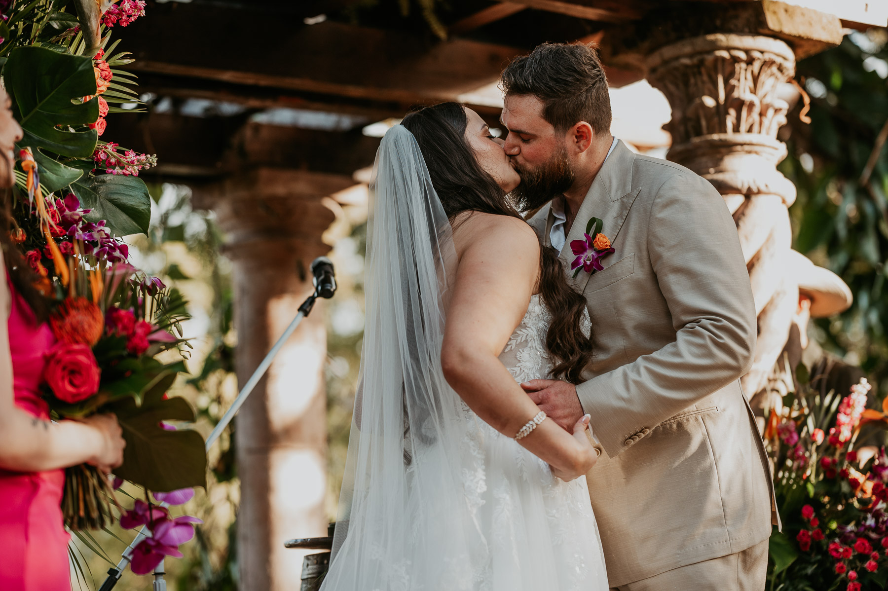 Couple sharing their first kiss as newlyweds