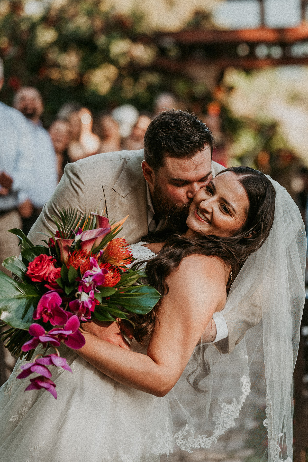 Couple sharing candid moment after wedding ceremony