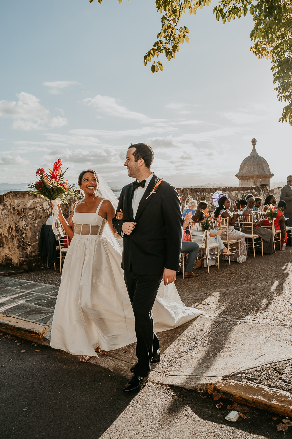 Bride and groom walking after saying I do at La Rogativa.