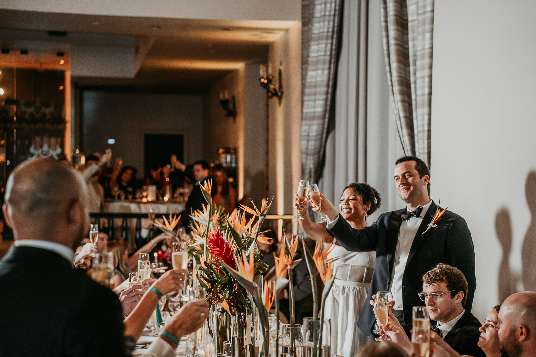 Guests cheering during the reception toast in Salon Campeche.