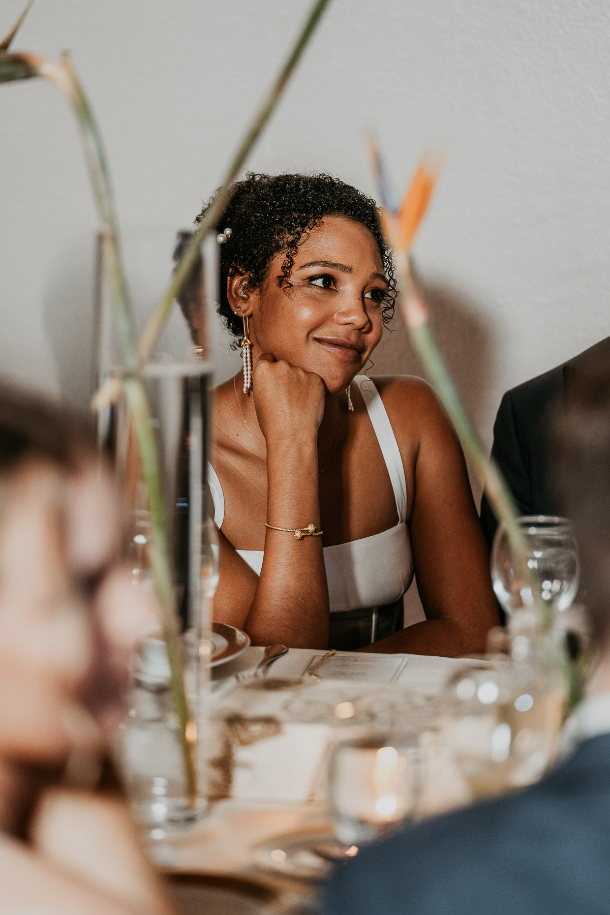 Candid moment of bride during toast.