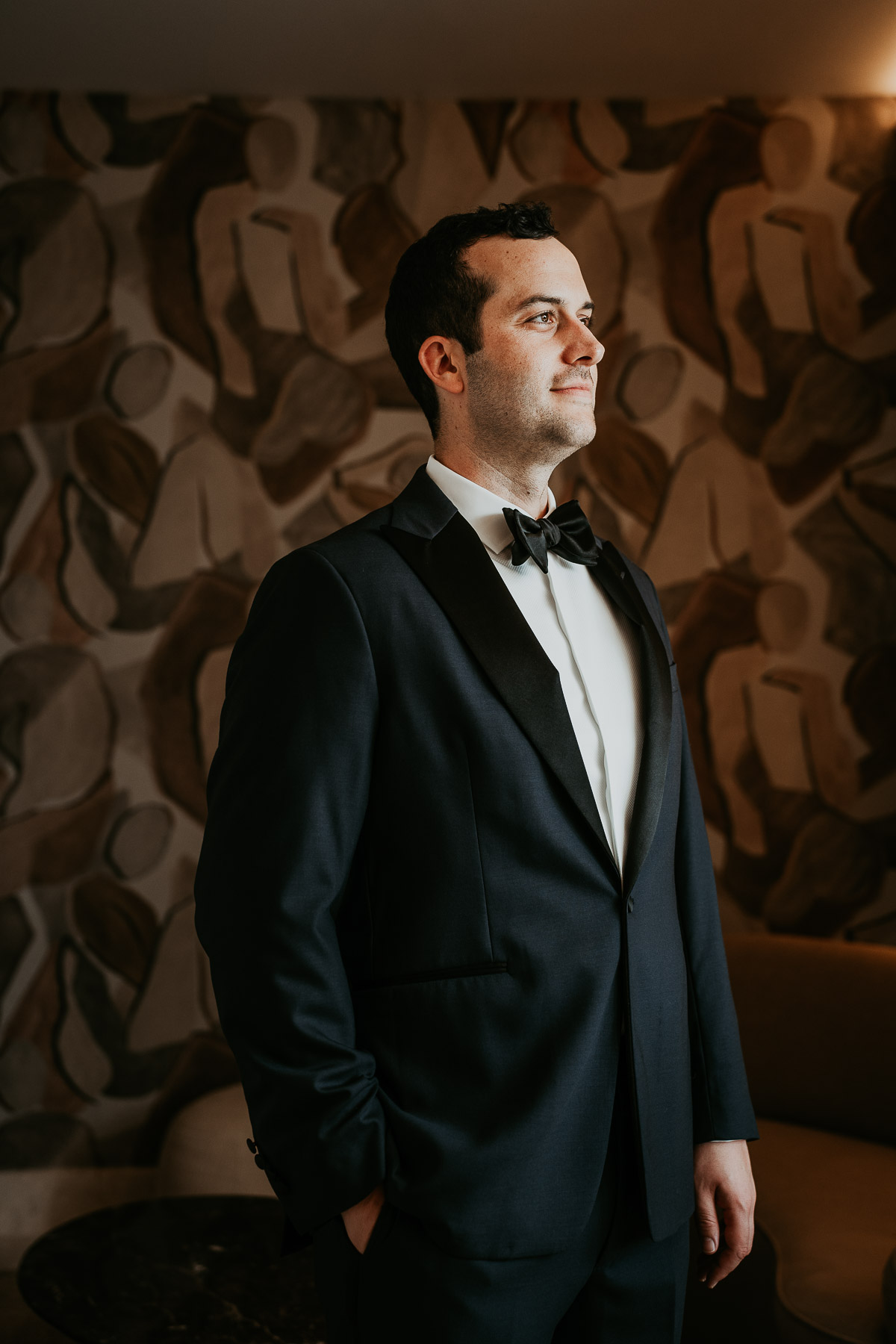 Groom in a sunlit room at Hotel El Convento.