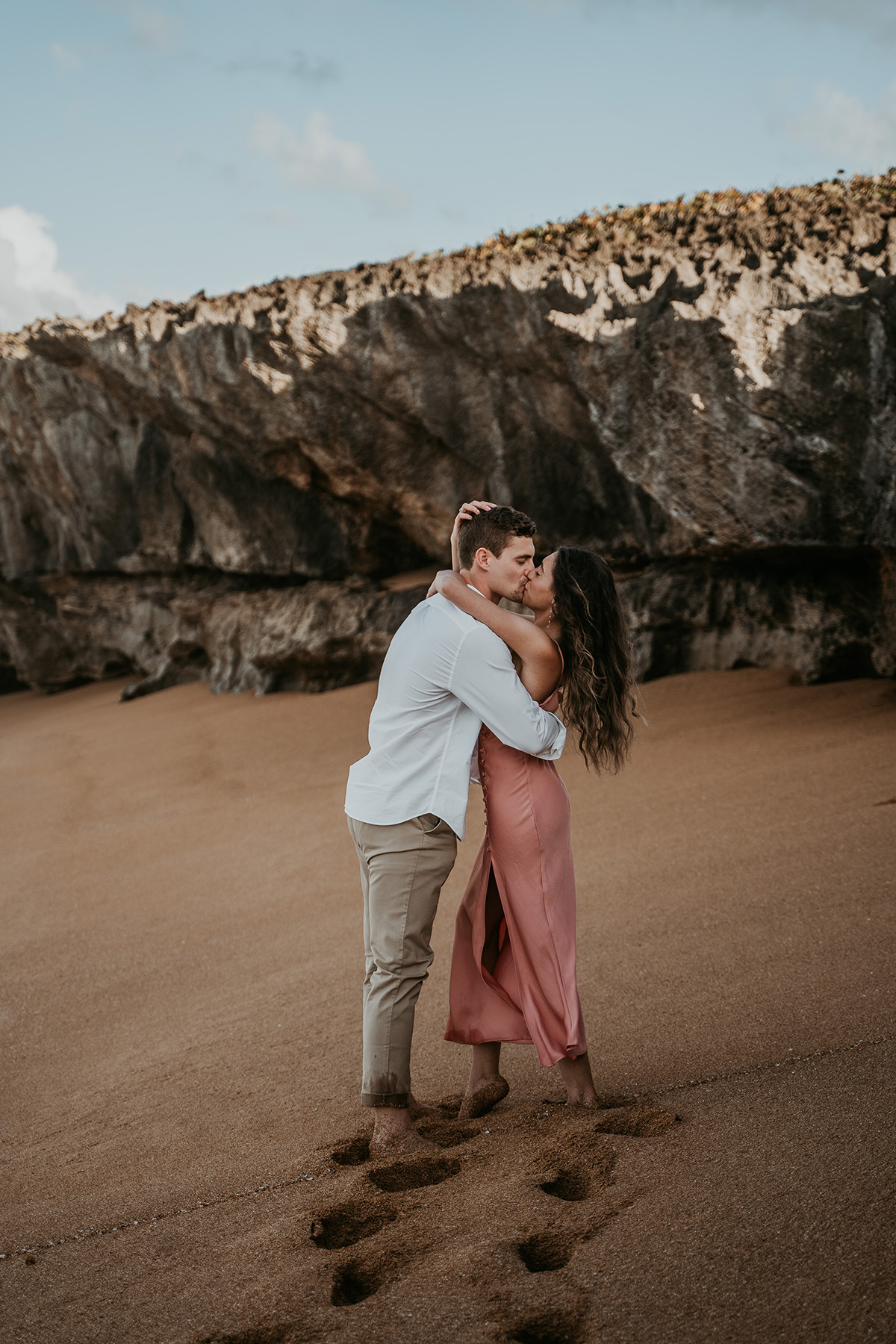 Surprise beach proposal at sunset in Puerto Rico.