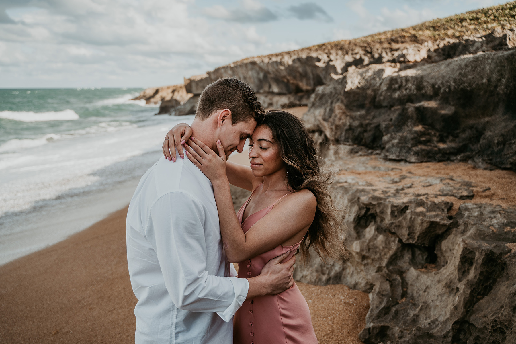 Couple celebrating beach proposal in Puerto Rico.