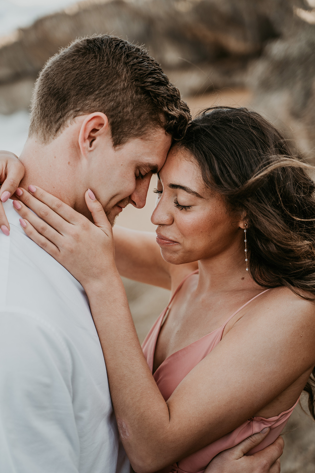 Couple celebrating beach proposal in Puerto Rico.