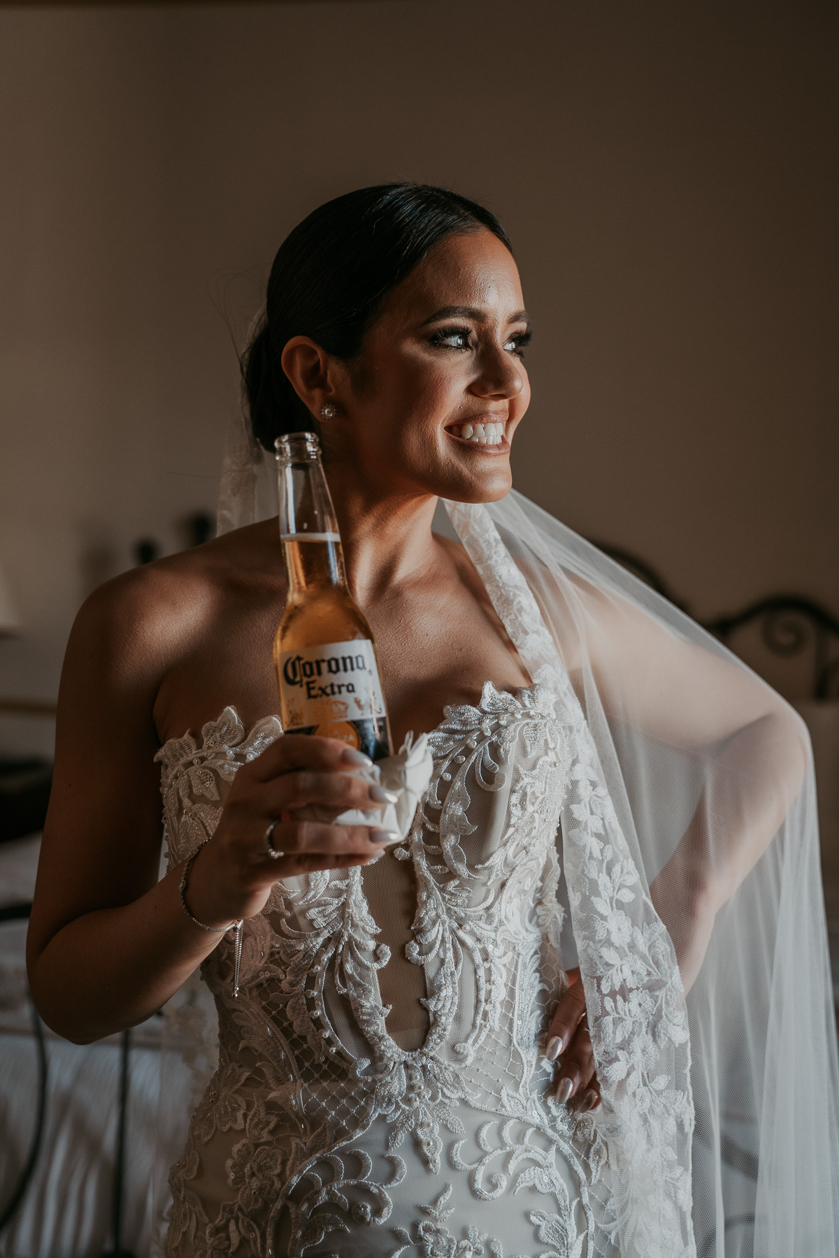 Candid photo of bride with Medalla beer at Hotel El Convento.