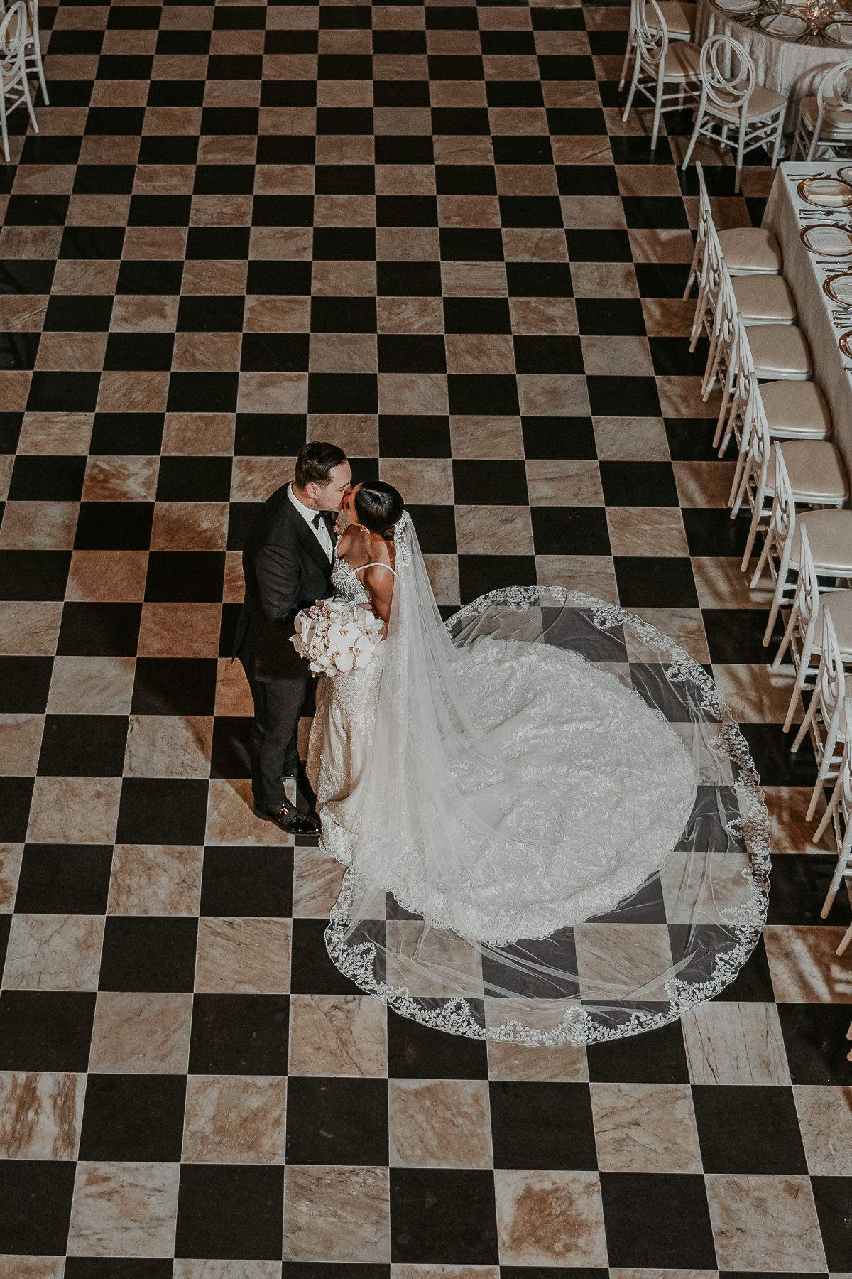 Wedding reception setup at Salon Campeche in Hotel El Convento, featuring elegant tables and Spanish colonial design.