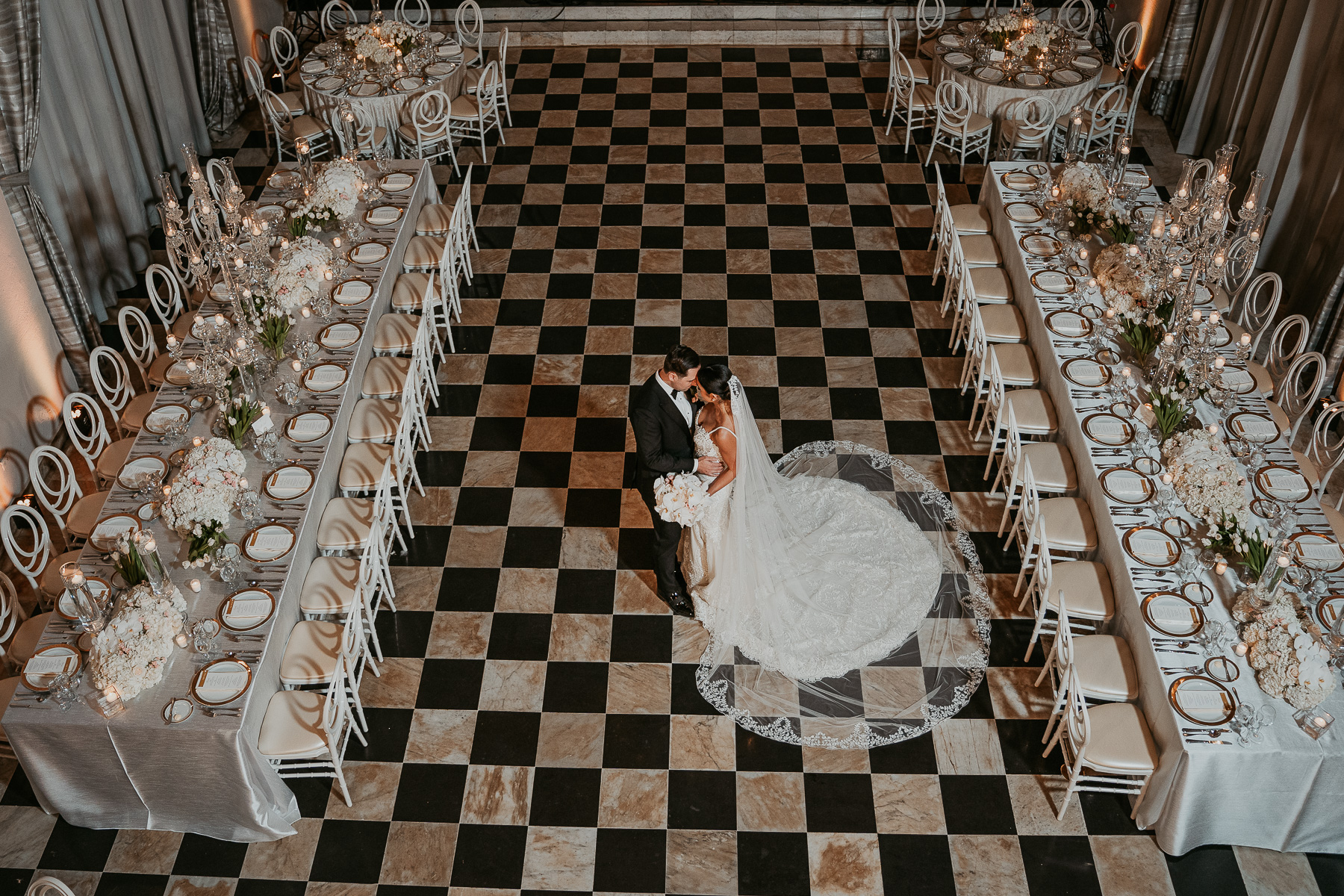 Wedding reception setup at Salon Campeche in Hotel El Convento, featuring elegant tables and Spanish colonial design.