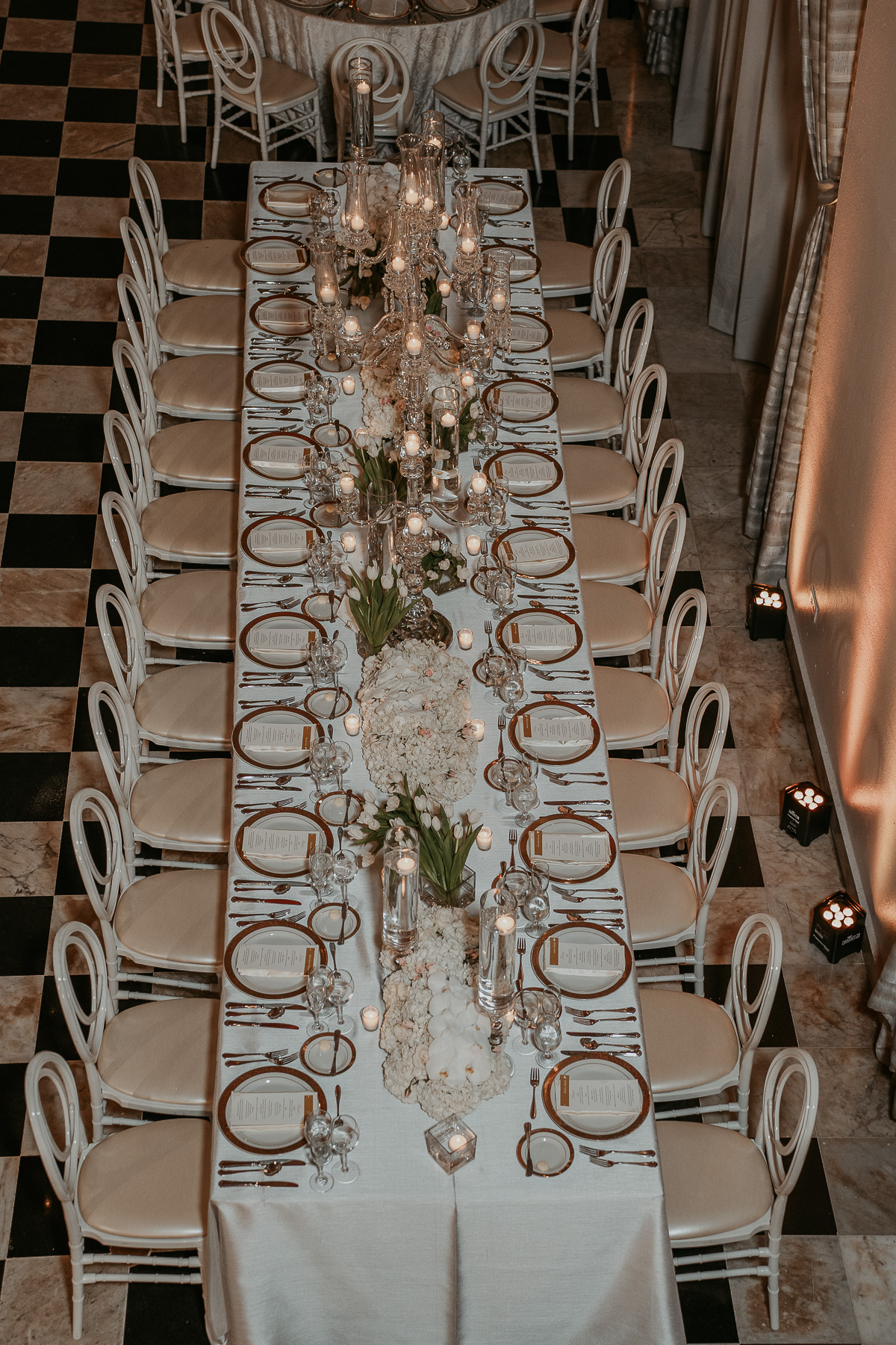 Wedding reception setup at Salon Campeche in Hotel El Convento, featuring elegant tables and Spanish colonial design.