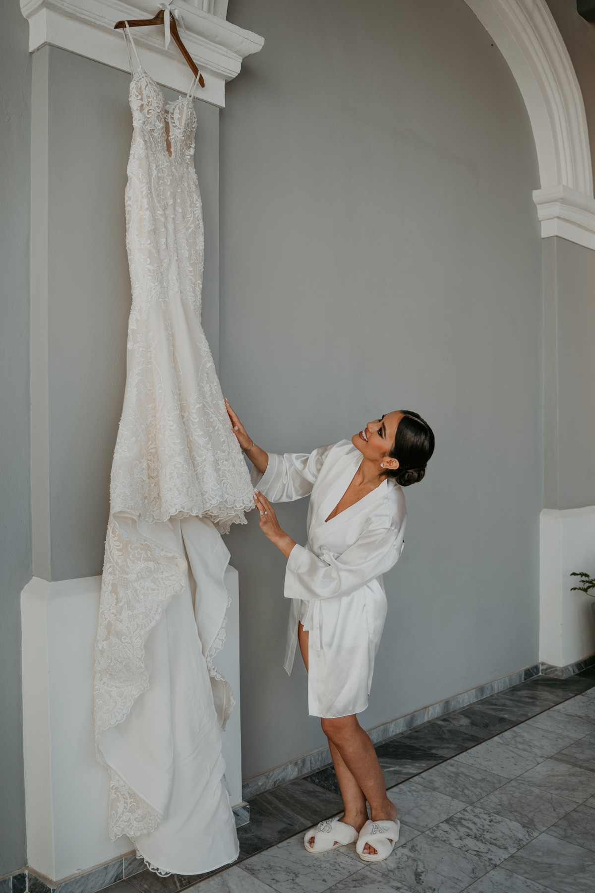 Bride looking at her dress during Puerto Rico wedding.