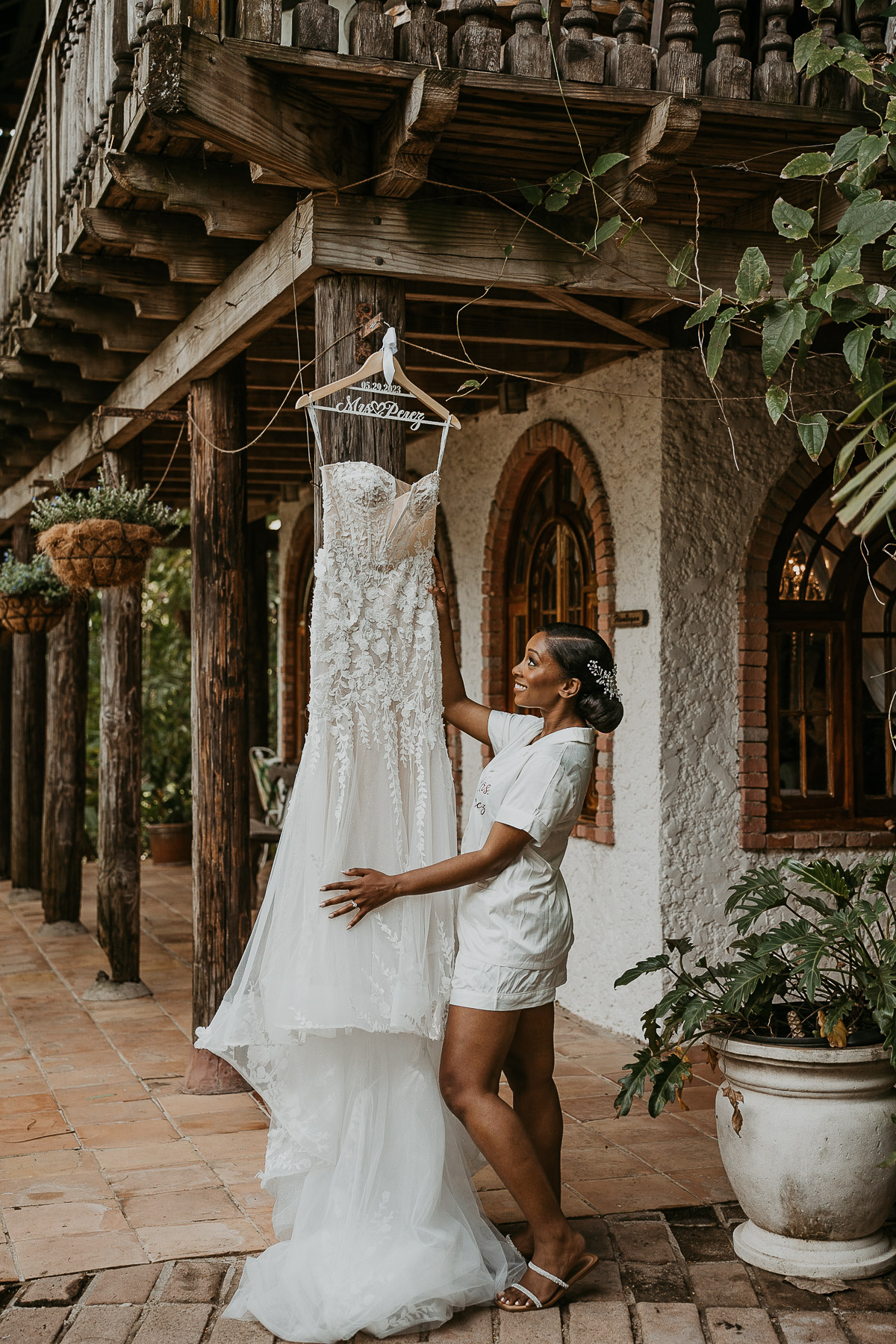 Bride looking at her dress before getting ready for her Hacienda Siesta Alegre Wedding.