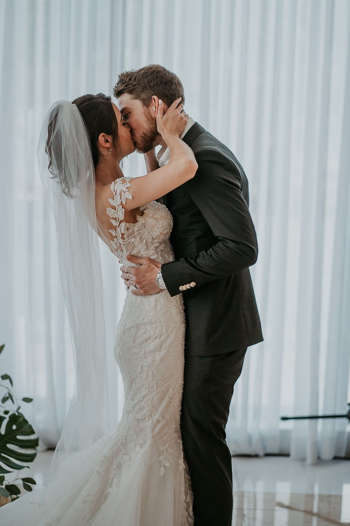 First kiss at Indoor ceremony at Hyatt Regency Grand Reserve Wedding.