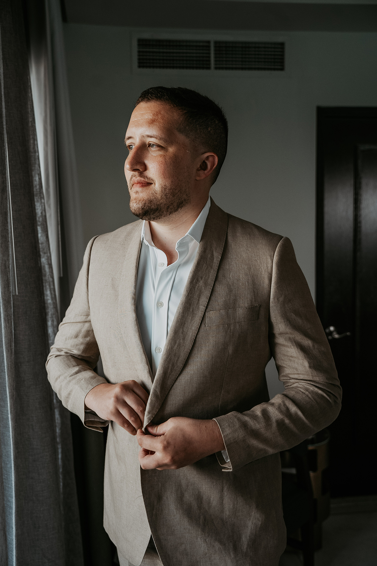 A candid moment as one groom prepares for his wedding day in Puerto Rico.