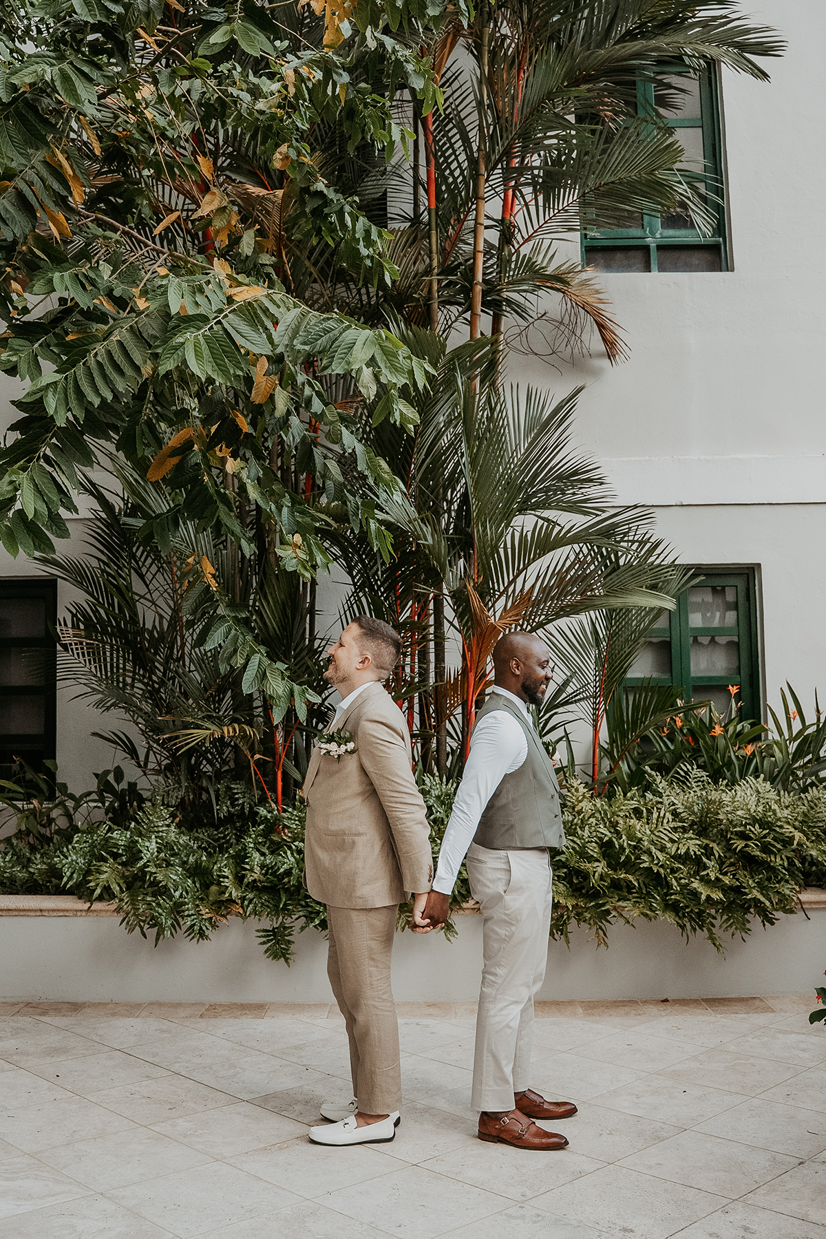 Two grooms share a private first look before their wedding ceremony in Puerto Rico.