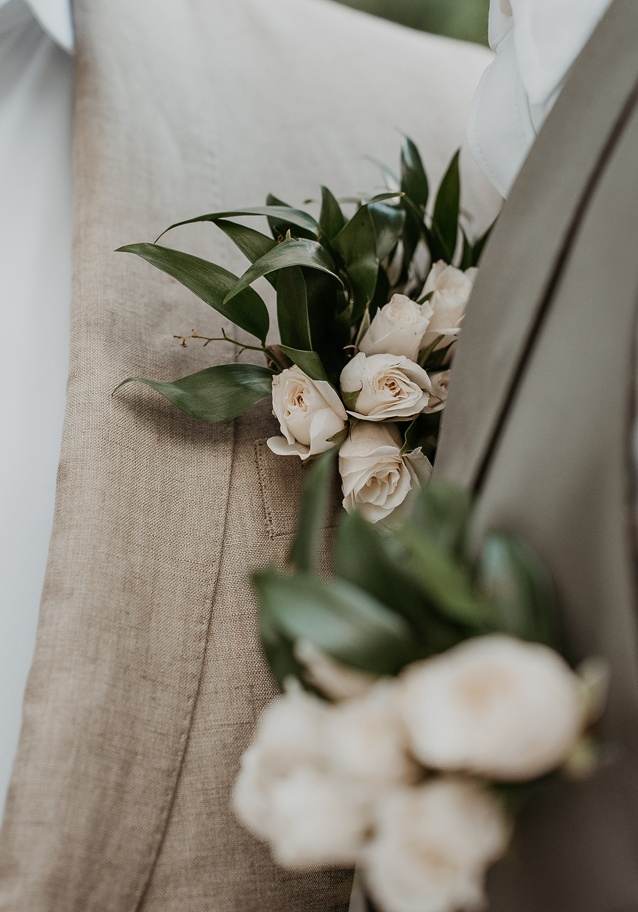 Floral boutonniere worn by both grooms for their elegant Puerto Rico gay wedding.