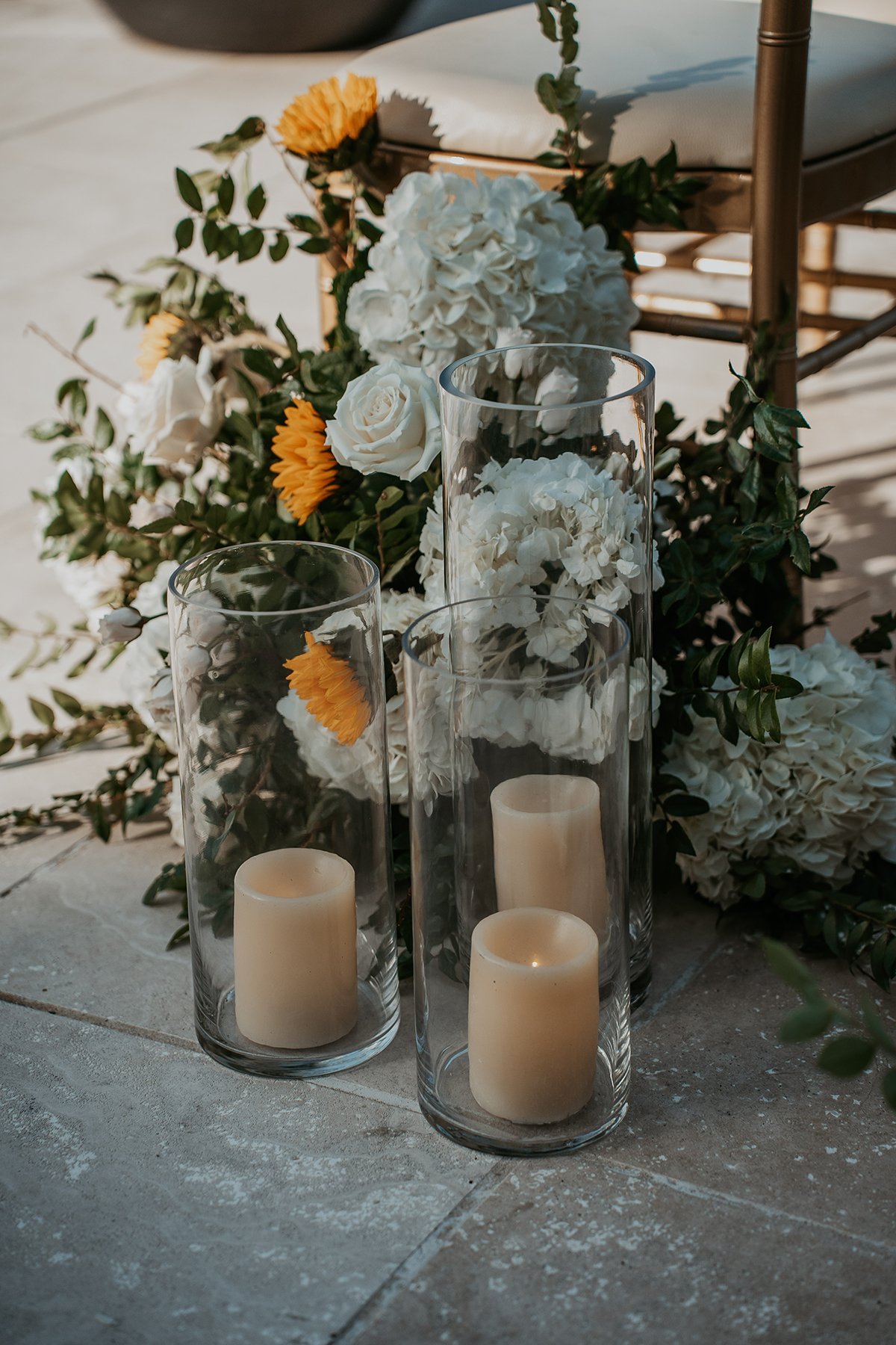Candles arranged as part of the wedding ceremony decor.