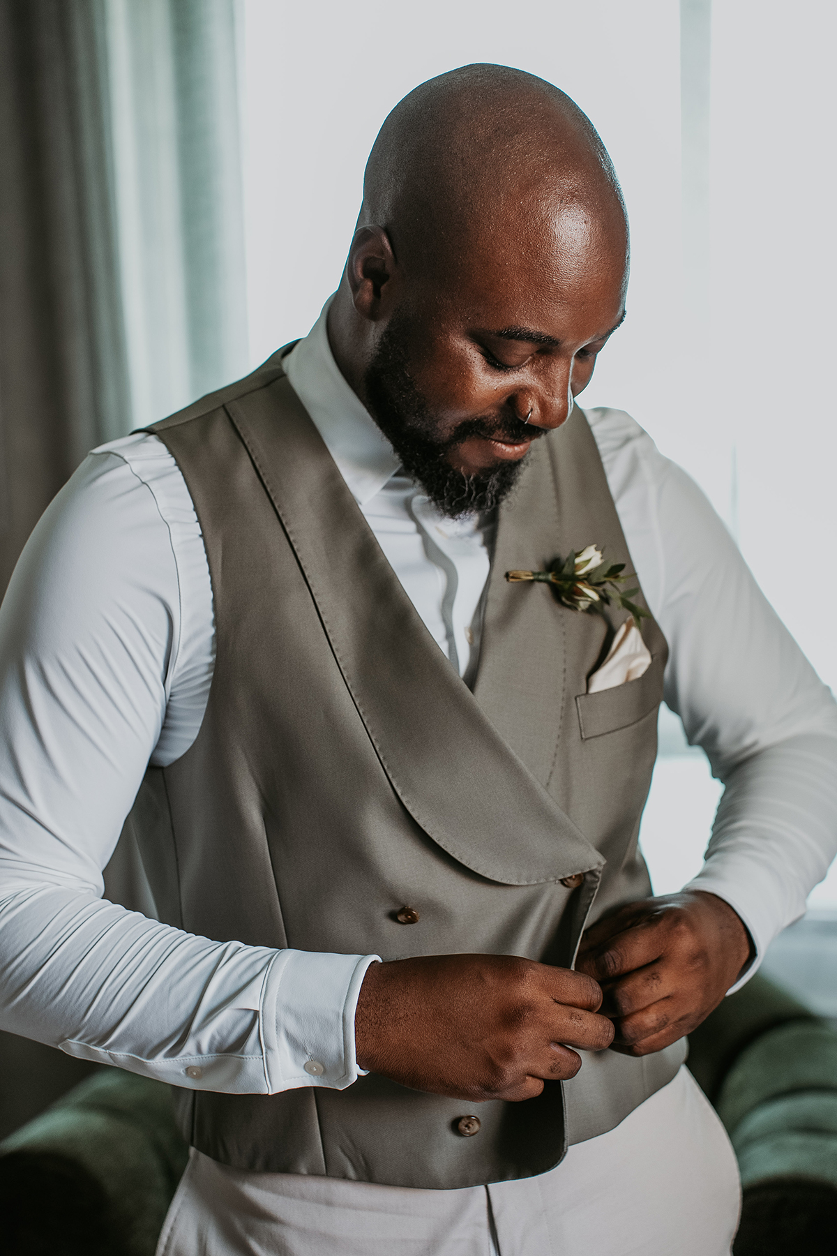Black groom getting ready for his wedding at the Condado Vanderbilt in Puerto Rico.