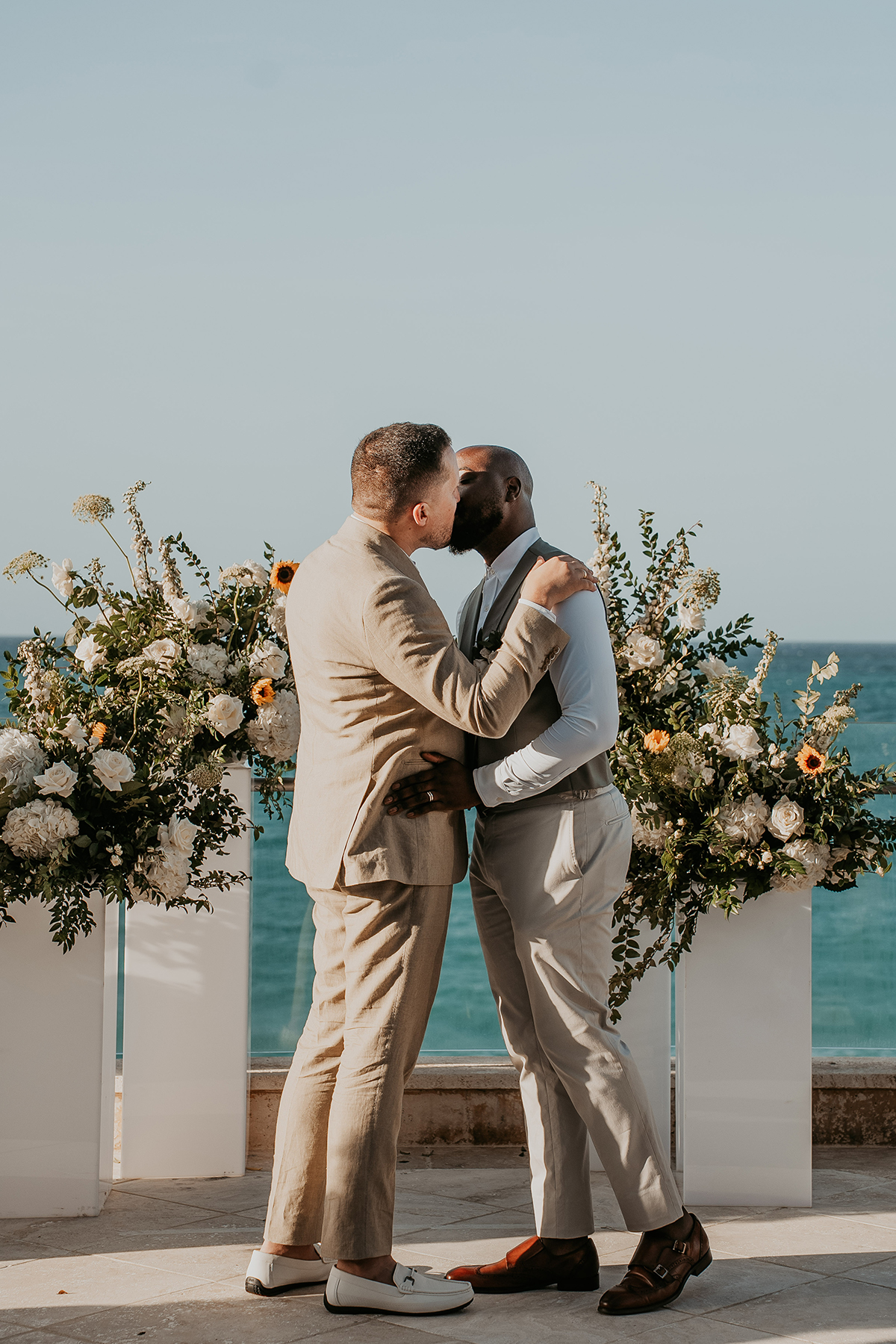 Two grooms share their first kiss as a married couple in Puerto Rico.