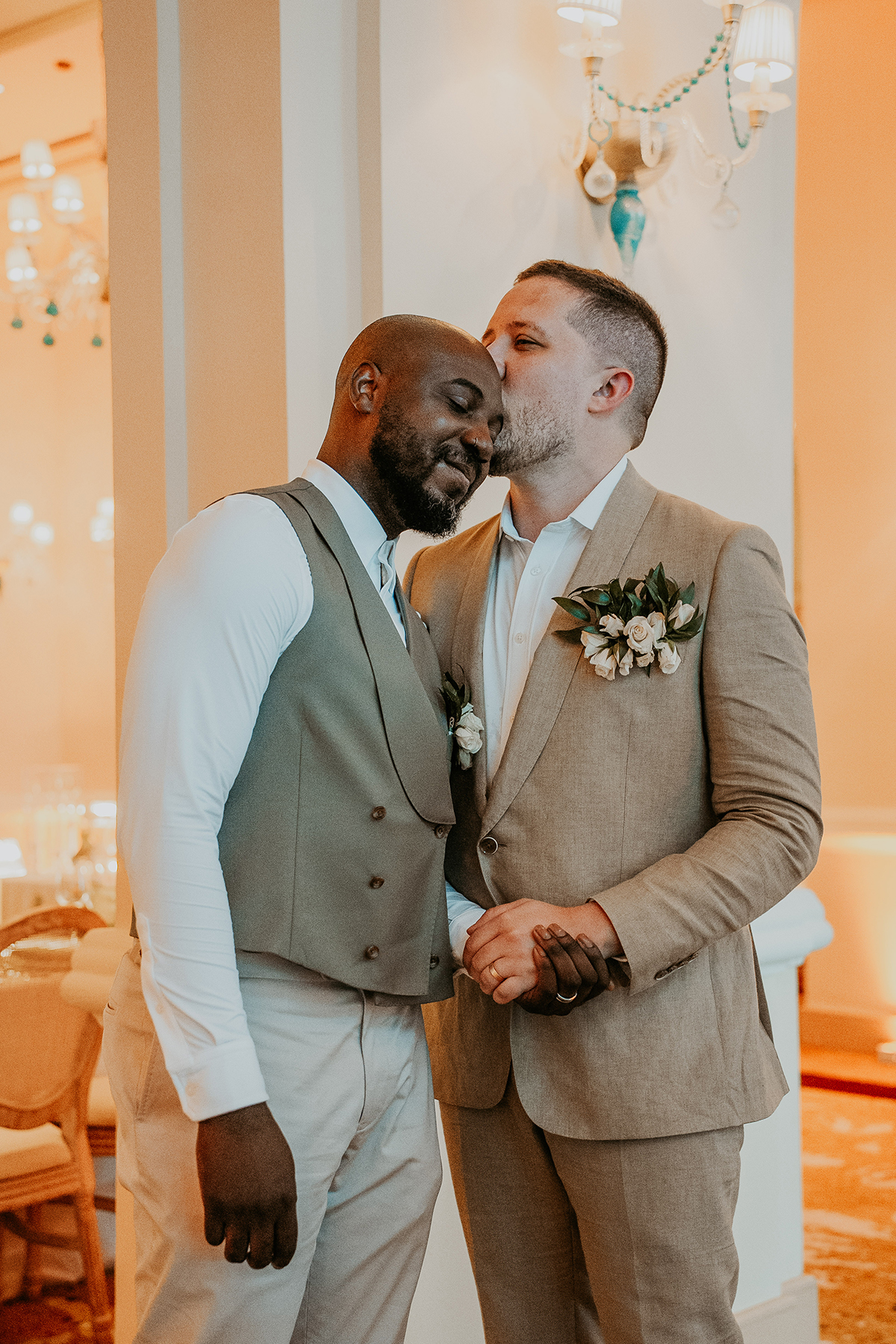 The newlyweds smile and embrace after their first kiss as a married couple.