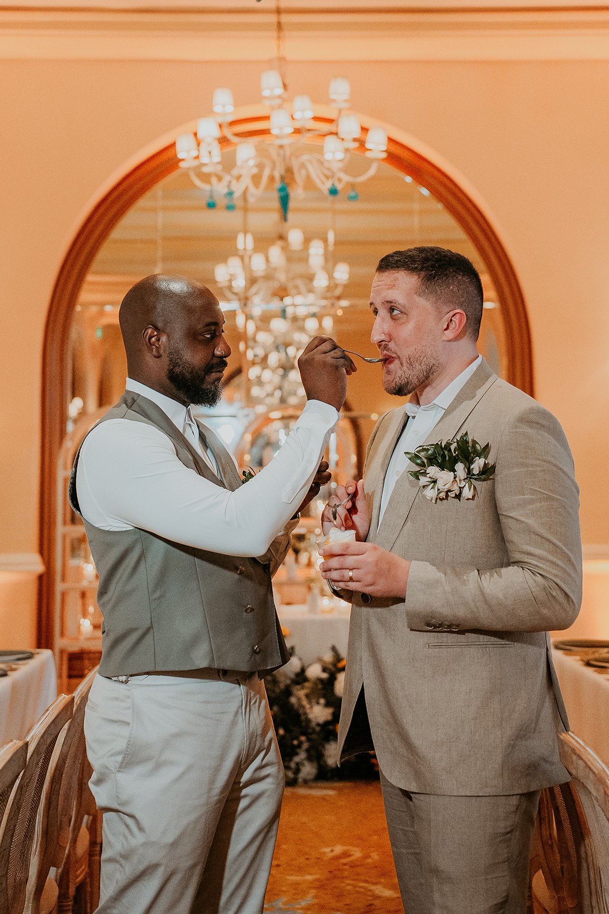 The newlyweds share a private toast together during their wedding celebration.