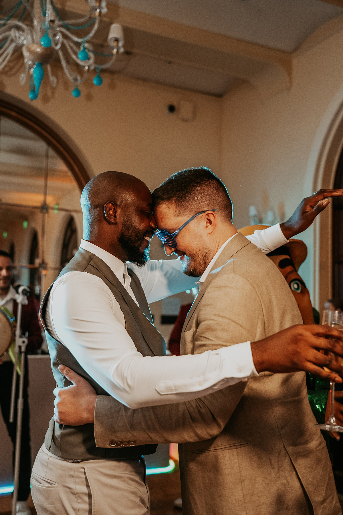 Two grooms enjoy the dance floor during their Puerto Rico wedding celebration.