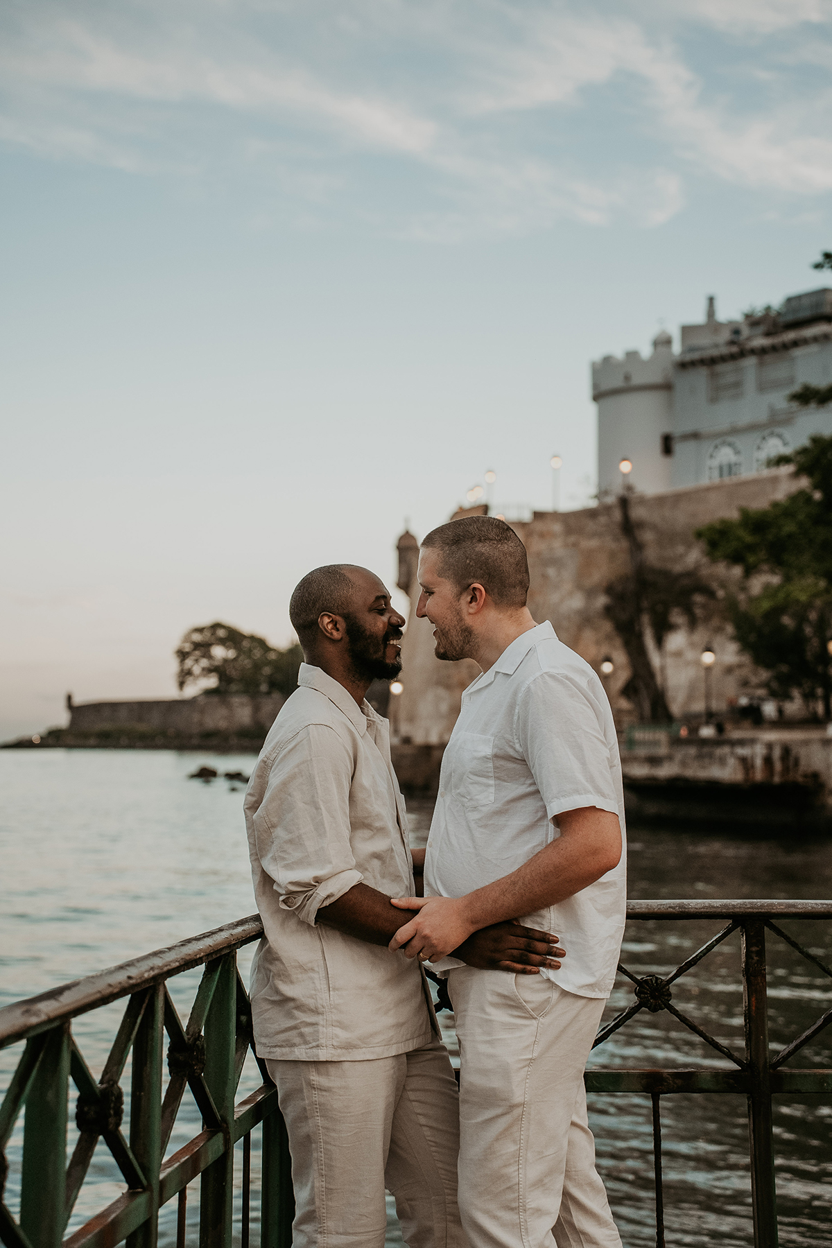 The grooms stroll together along Paseo de la Princesa in Old San Juan.