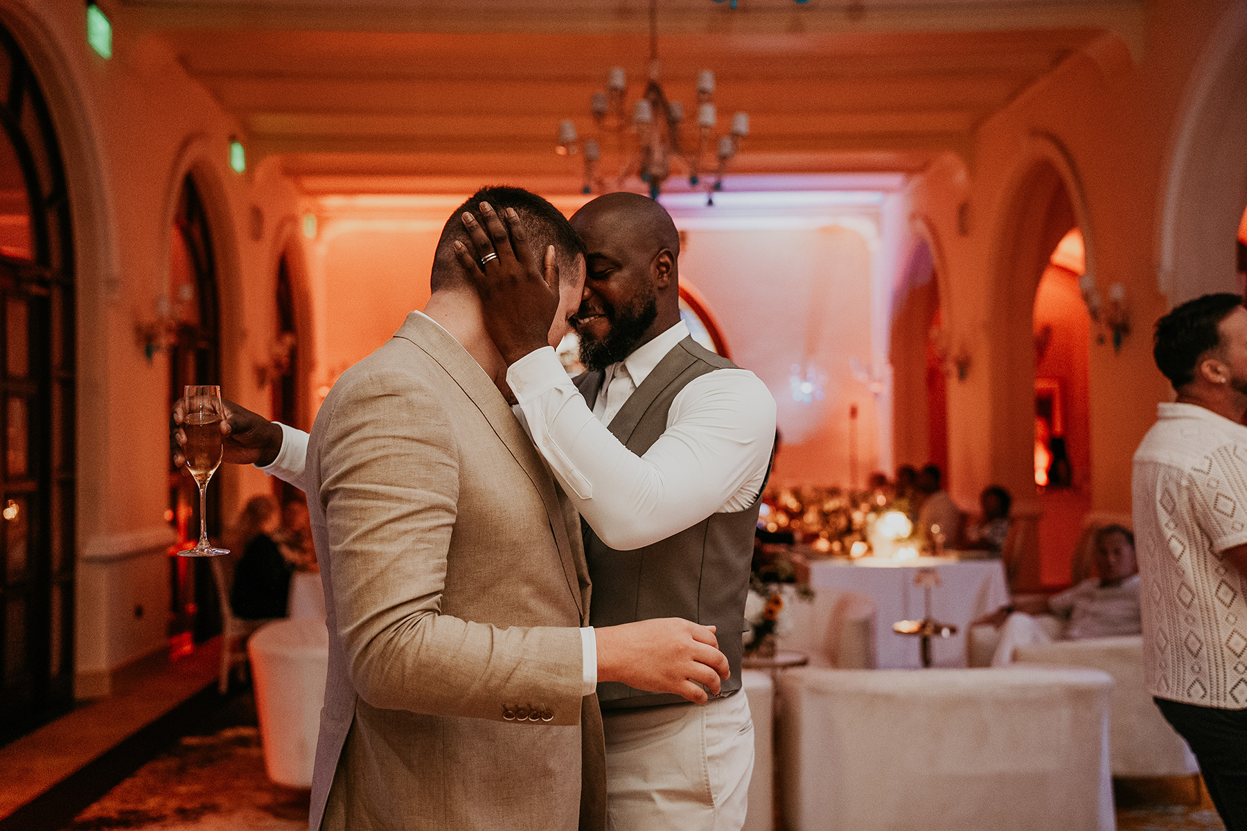 Two newlywed gay grooms enjoy the dance floor during their Puerto Rico wedding celebration.