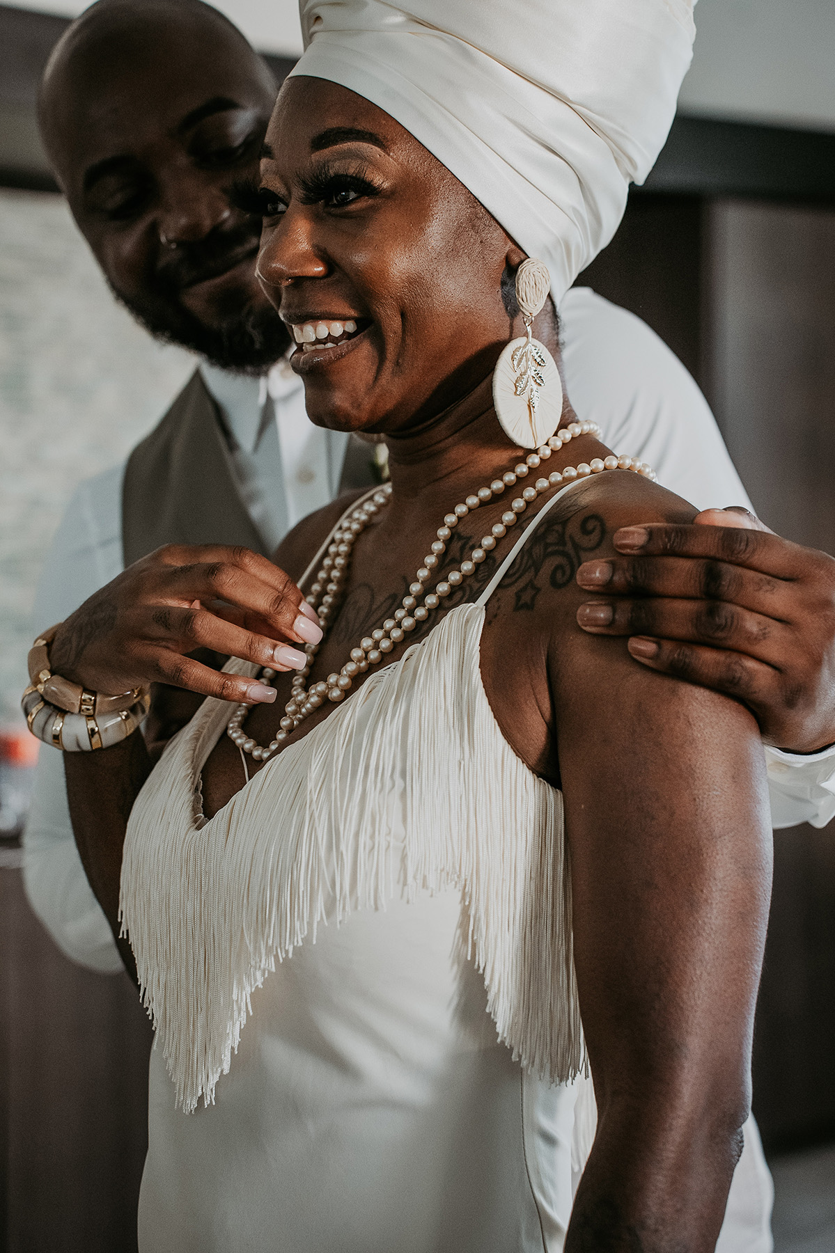 One groom shares a heartfelt gift after first look with his sister before the ceremony.