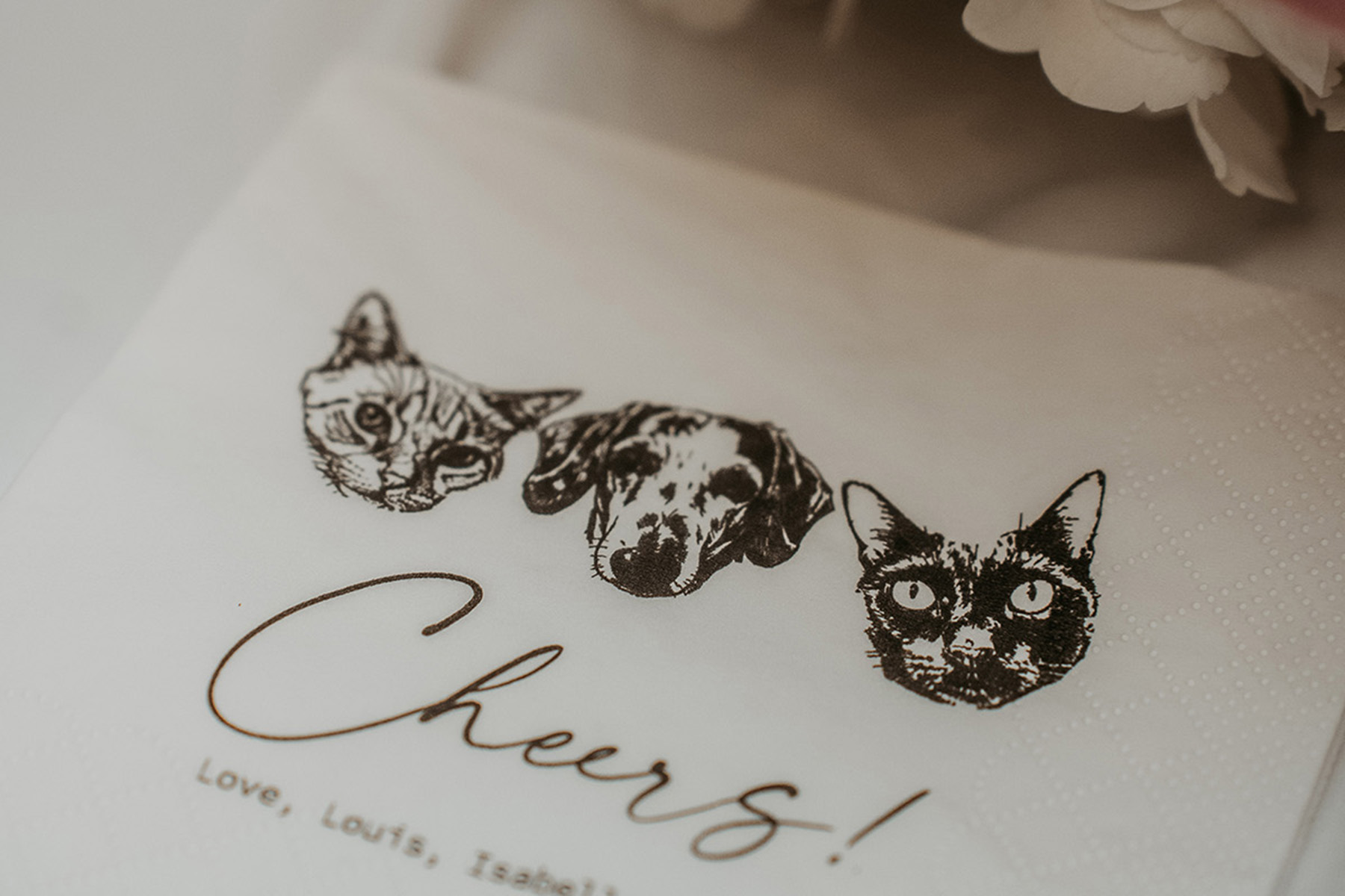 Close-up of wedding napkins with pets stamped on