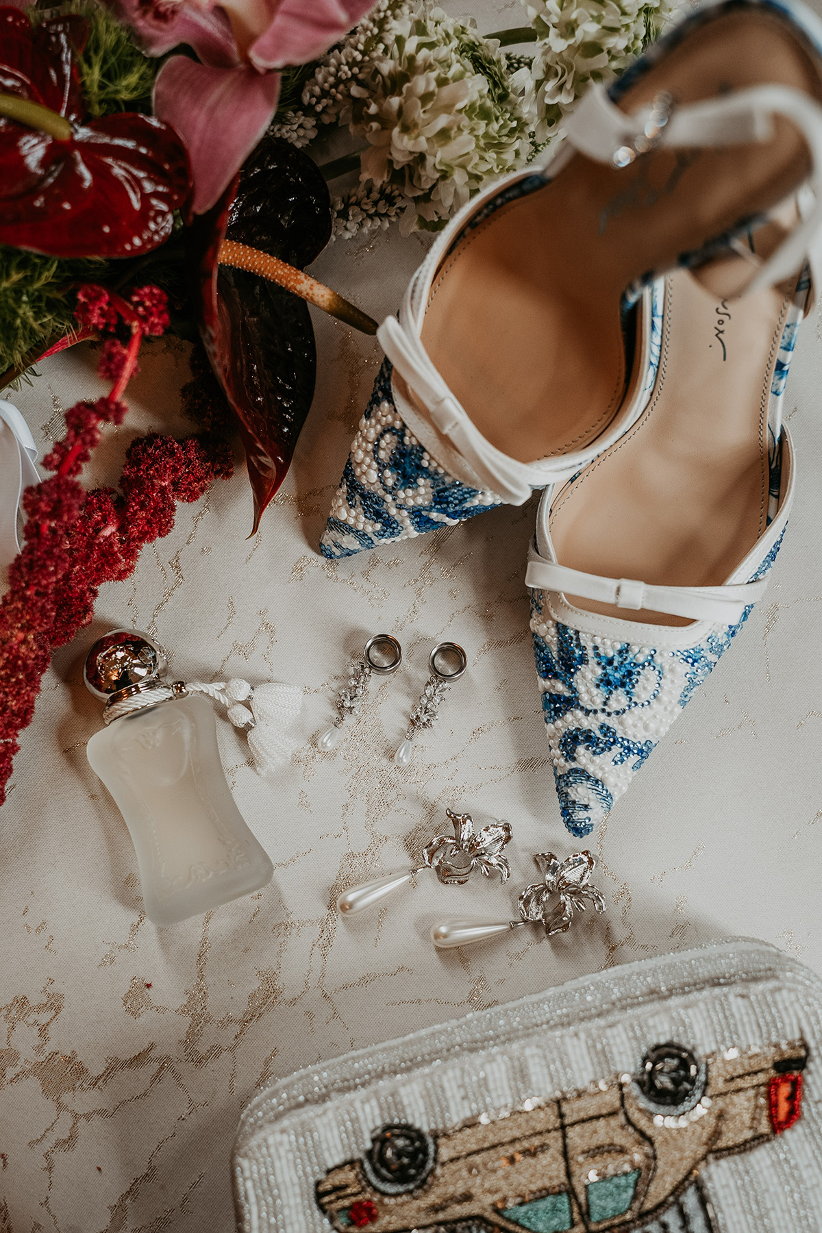 Wedding accessories arranged together in a flat lay