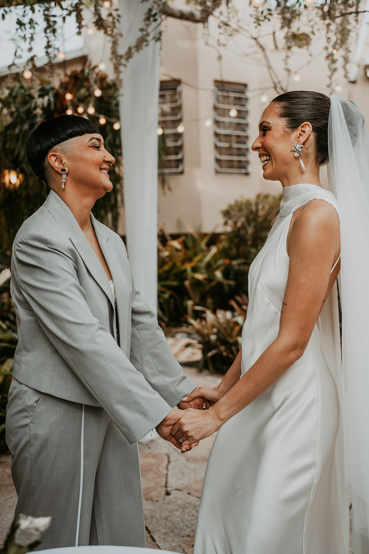 Newlywed couple laughing during their wedding ceremony