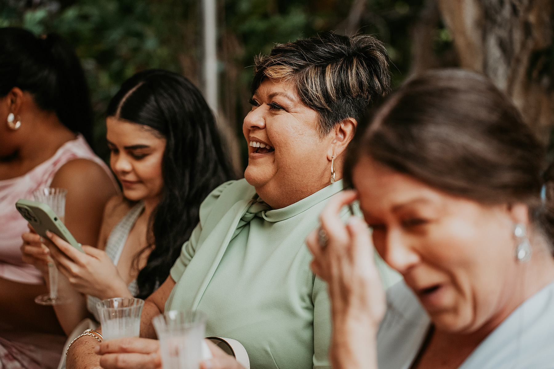 Wedding guests sharing a joyful moment during the celebration