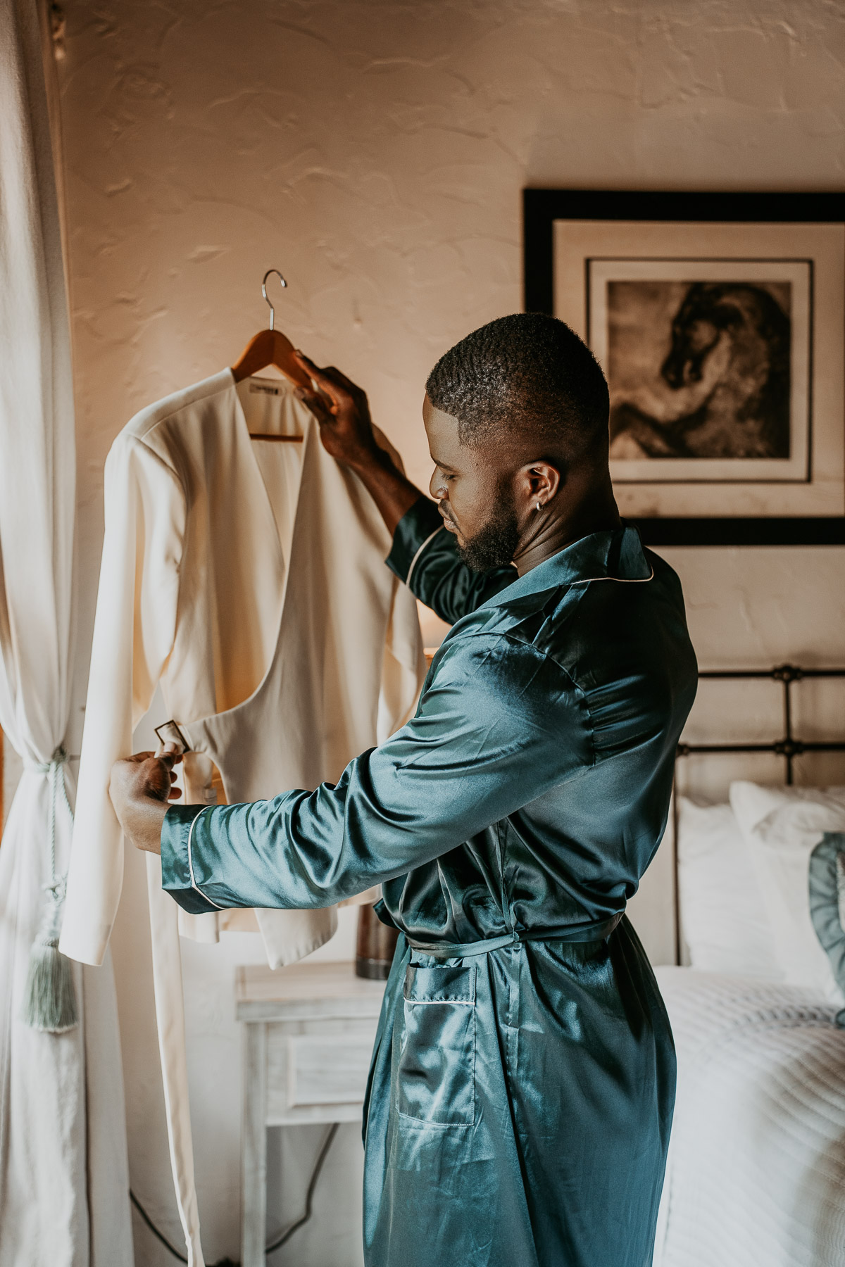 A wedding couple looking at their wedding outfit.