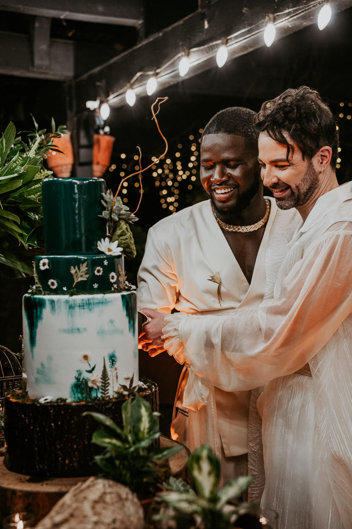 A happy couple celebrating their love with a cake cutting ceremony at Hacienda Siesta Alegre.