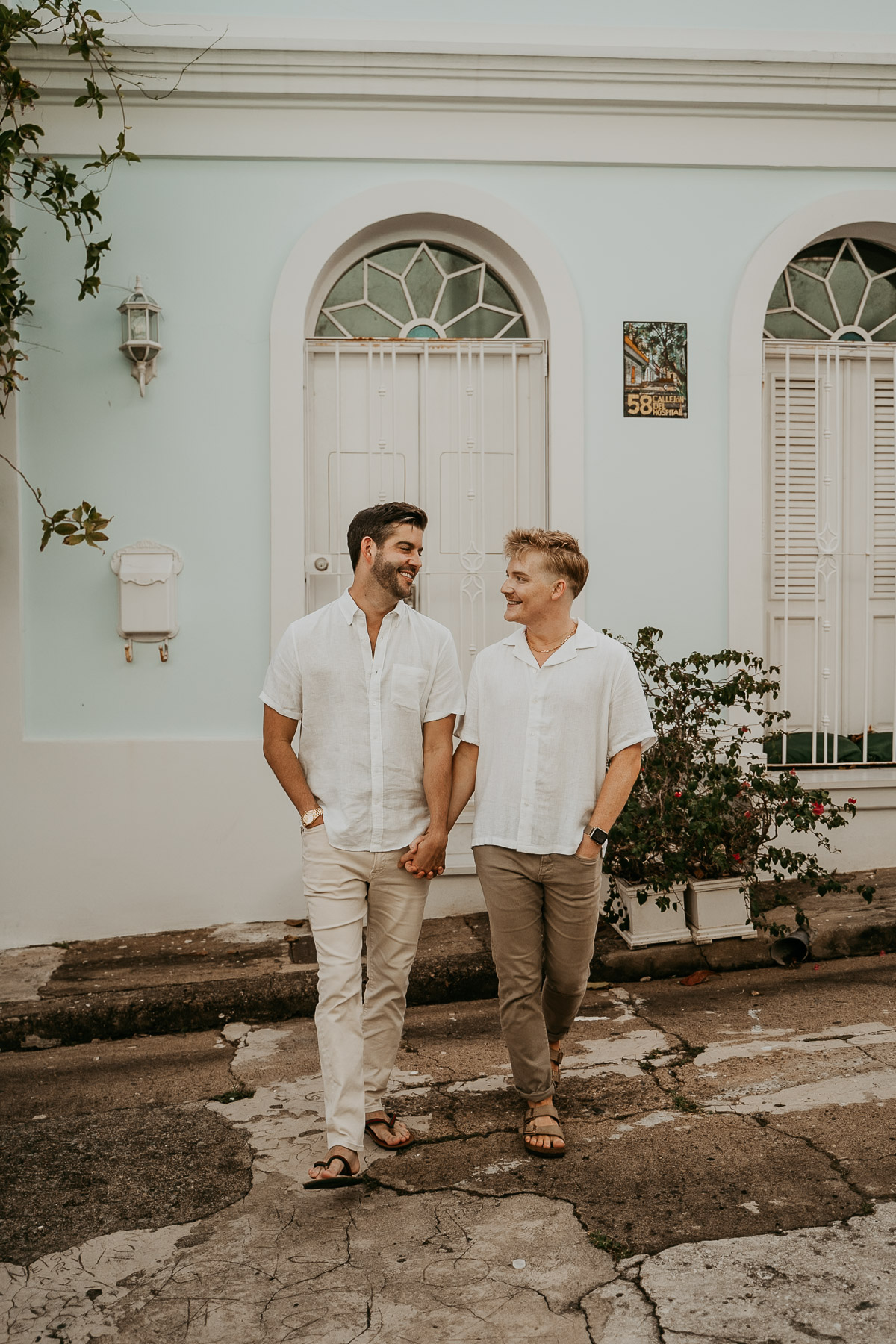 Gay couple strolling through the streets of Old San Juan.