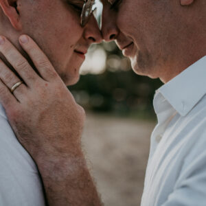 Gay couple beach tropical wedding