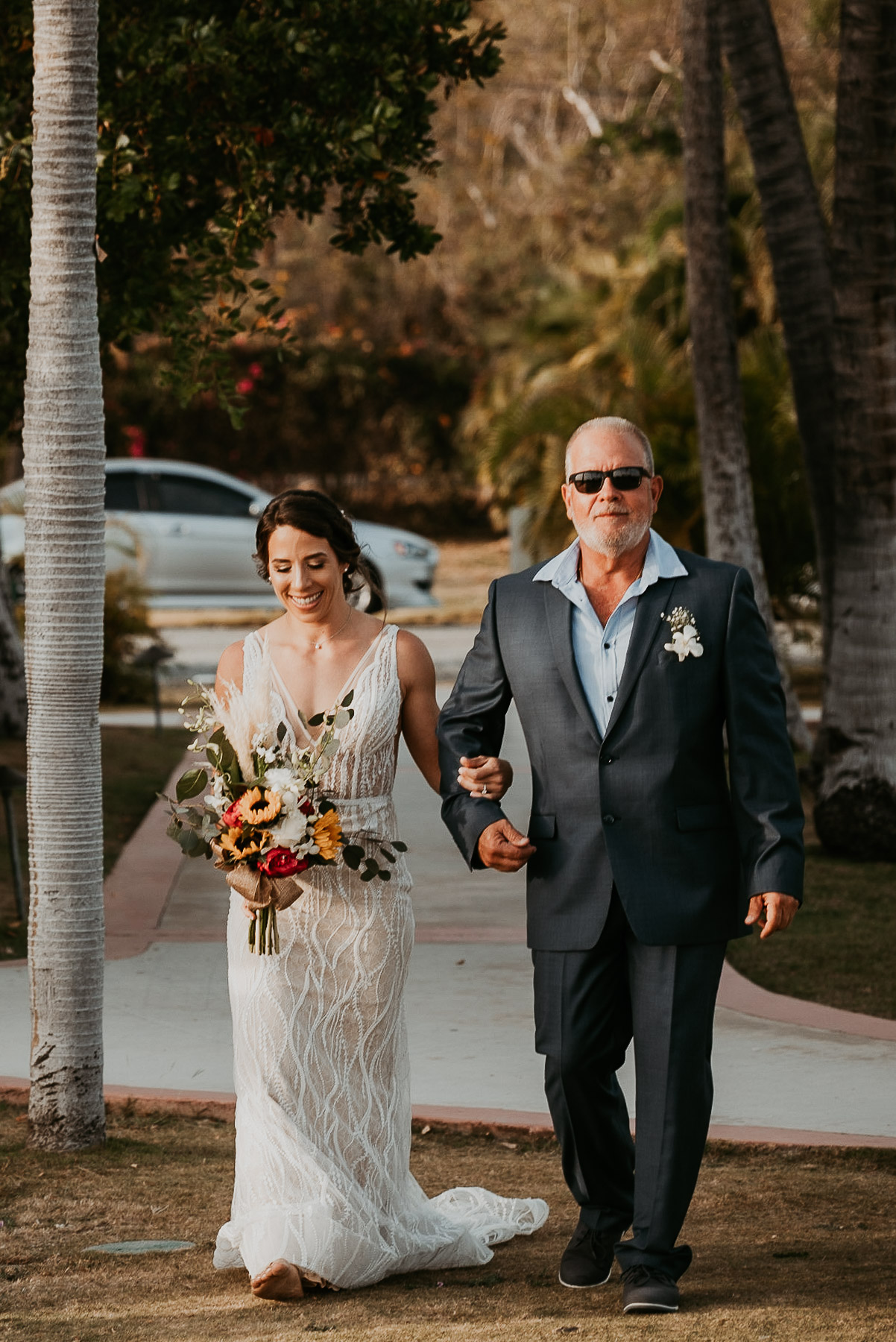 Bride walking down the Isle with dad at Copamarina Beach Resort.