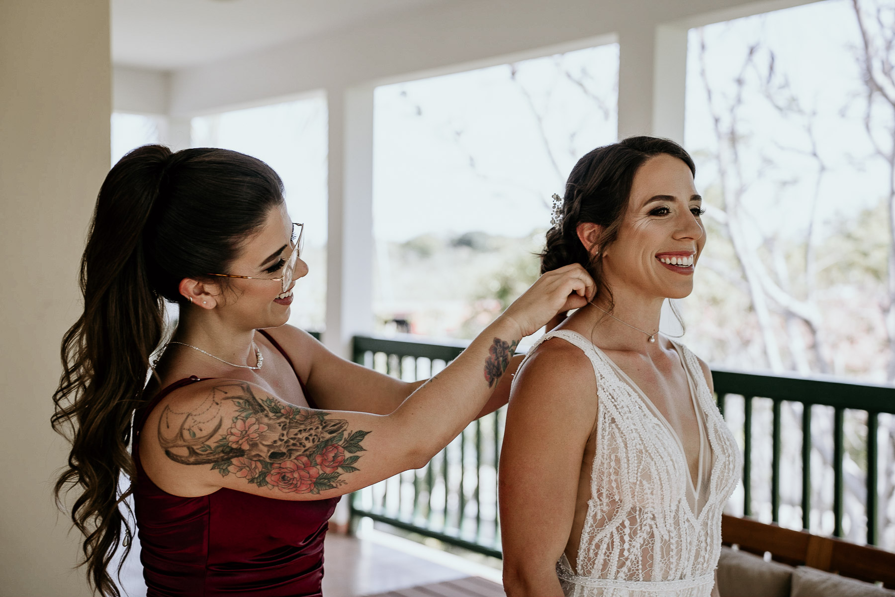 Candid moment between bride and her sister during getting ready.