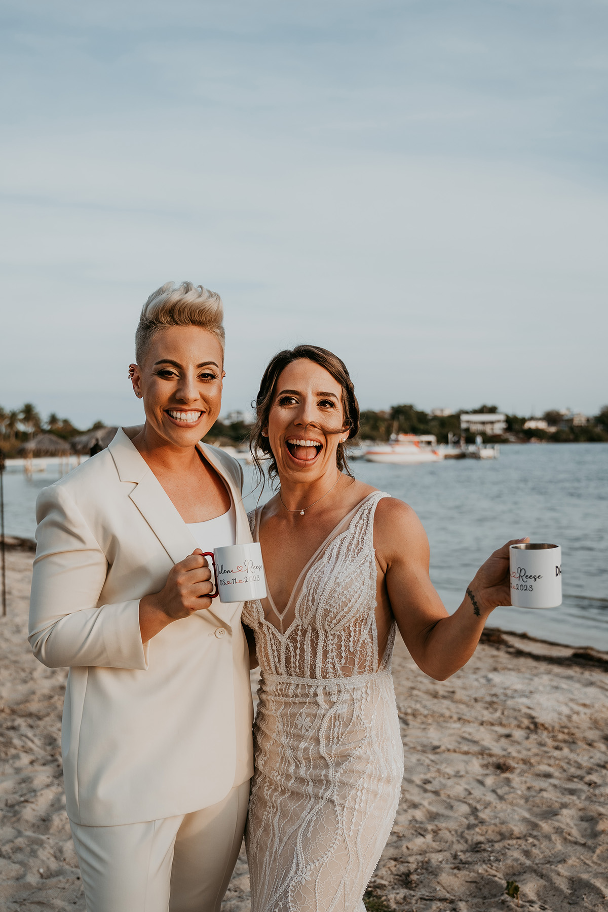 Two Brides Holding coffee cups to celebrate their LGBTQ+ Wedding at Copamarina Beach Resort.