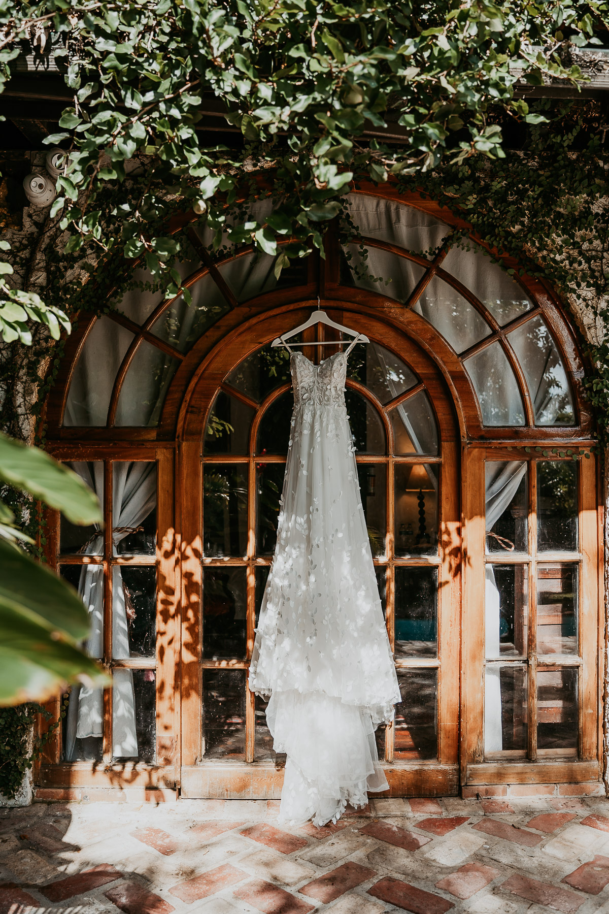 Wedding dress hung over doors at Hacienda Siesta Alegre