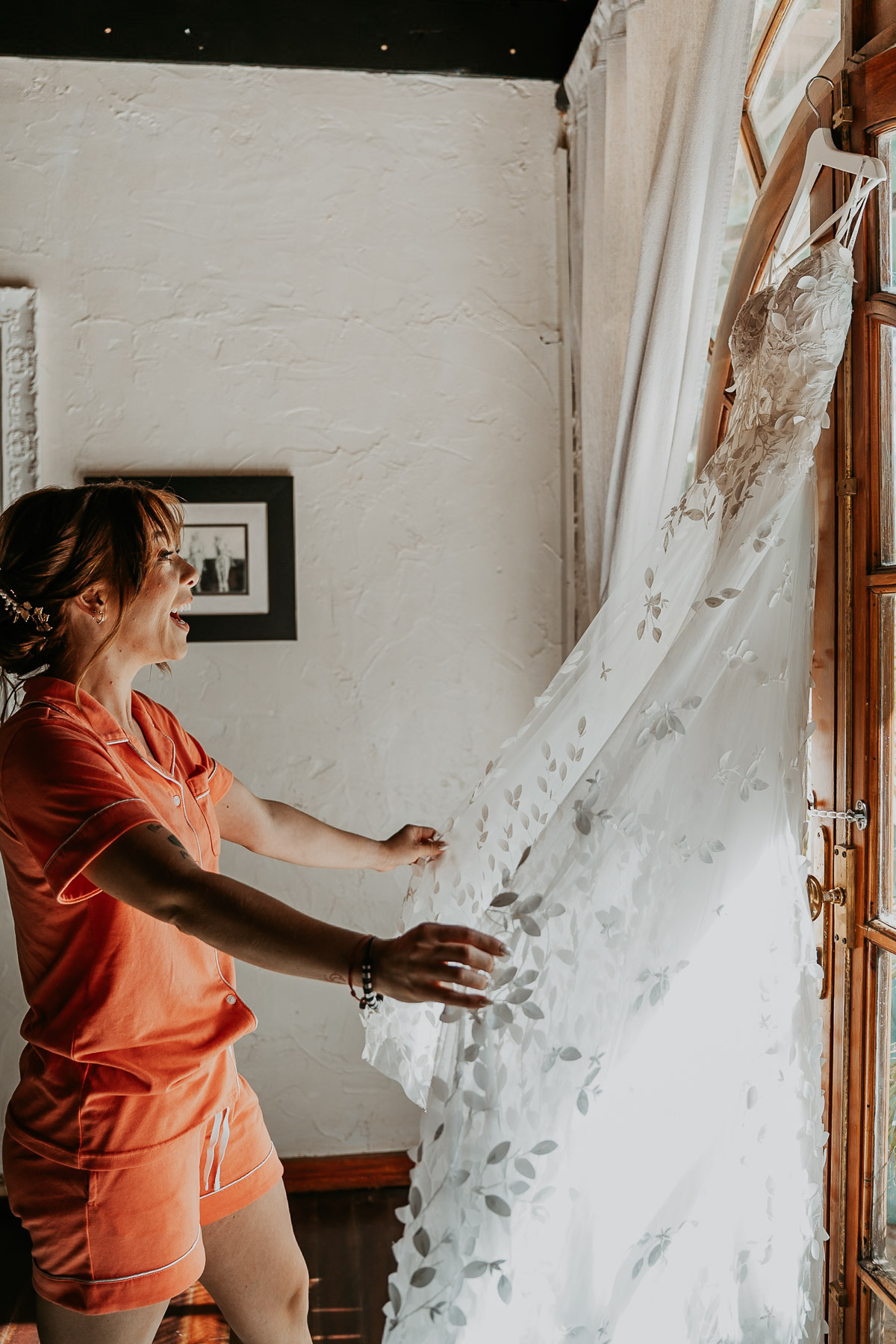 Bride admiring her dress