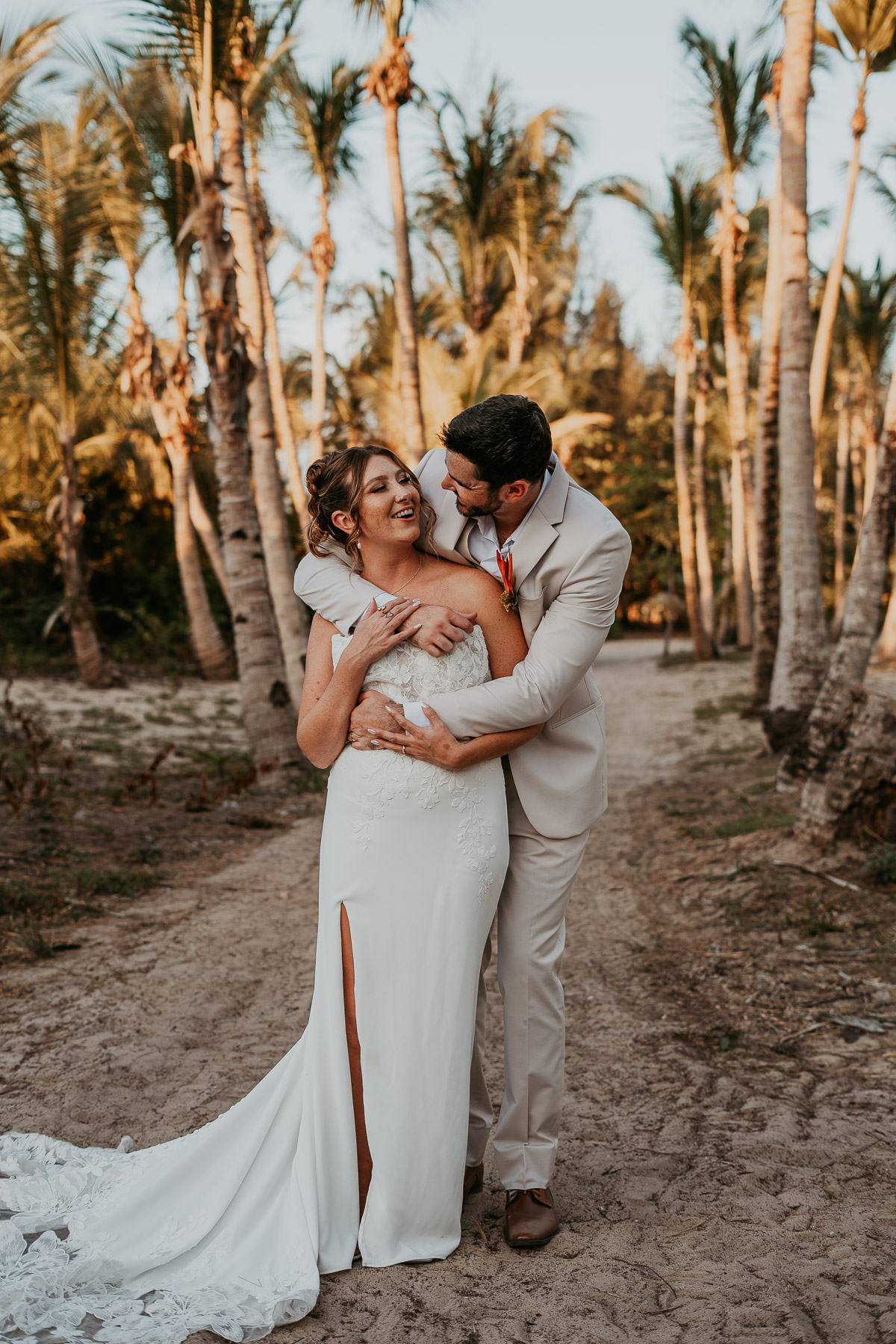 Candid embrace between newlywed couple